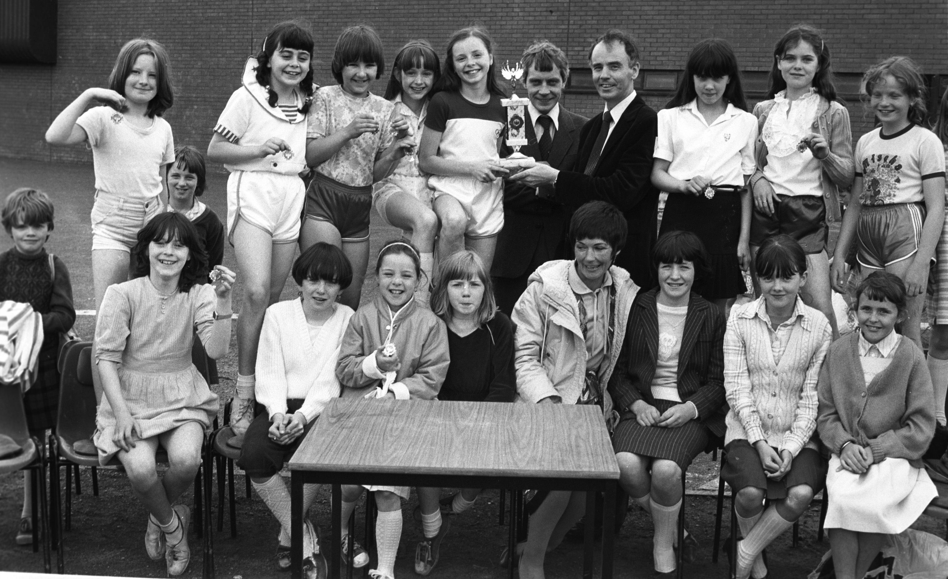 St Joseph's Slate Street Girls with Jim Gillen (Liberty Financial Services) and Eugene Haren (GRC) at the Falls Inter-primary schools’ sports day at Grosvenor Recreation Centre