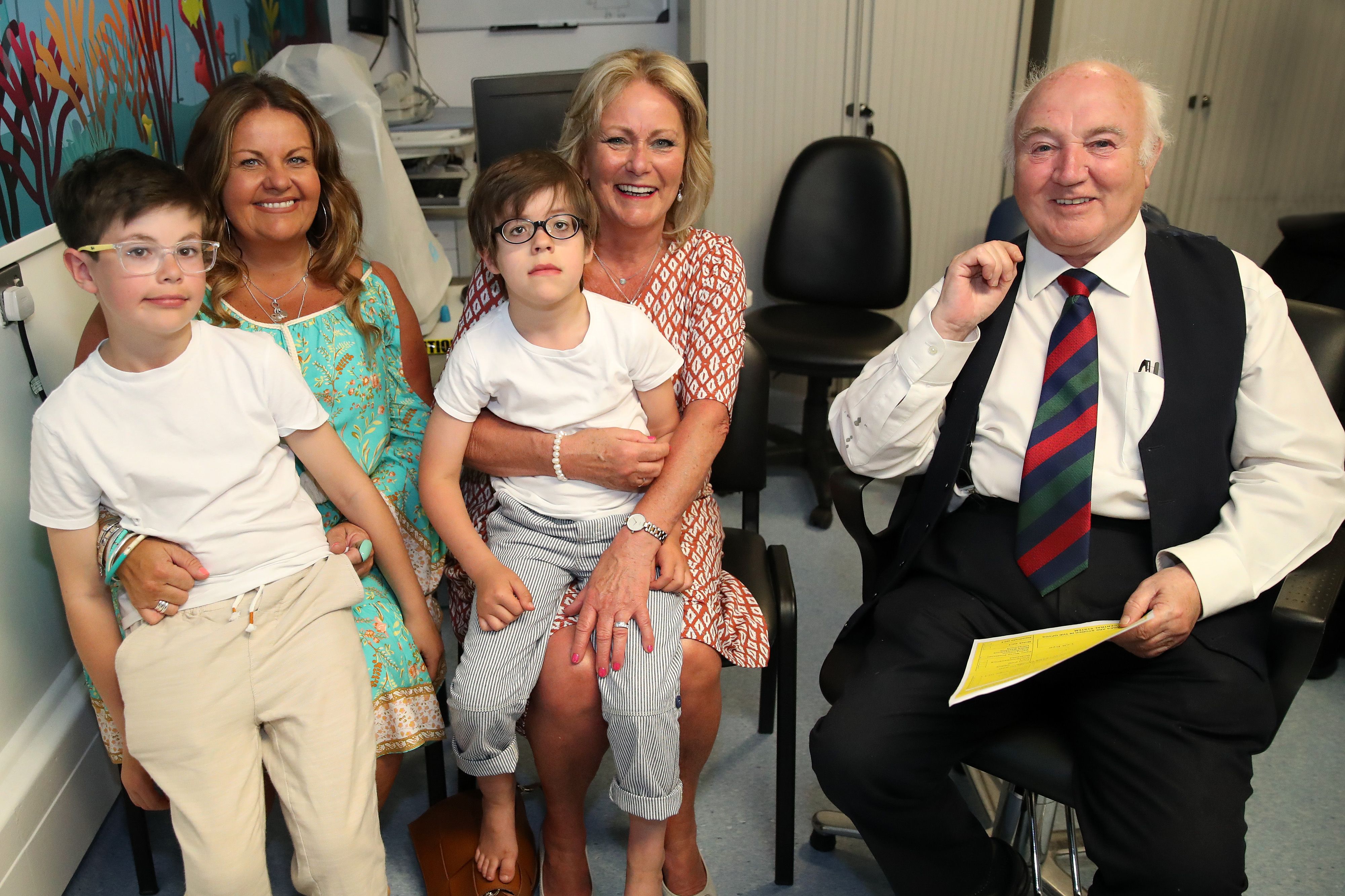 Dr Terry Cross with families who benefitted from the use of the scanner