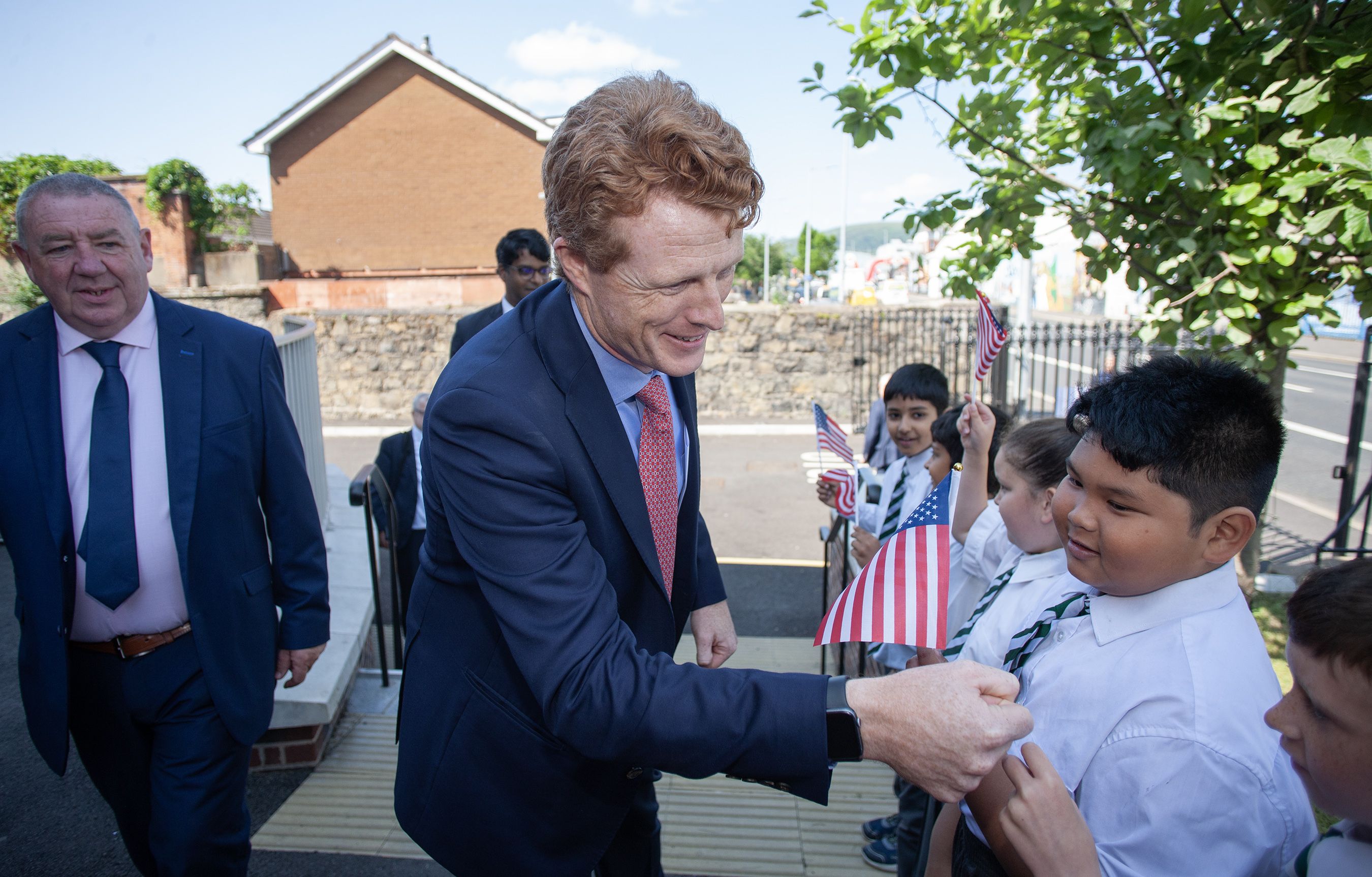Joe Kennedy fist pumps a West Belfast pupil