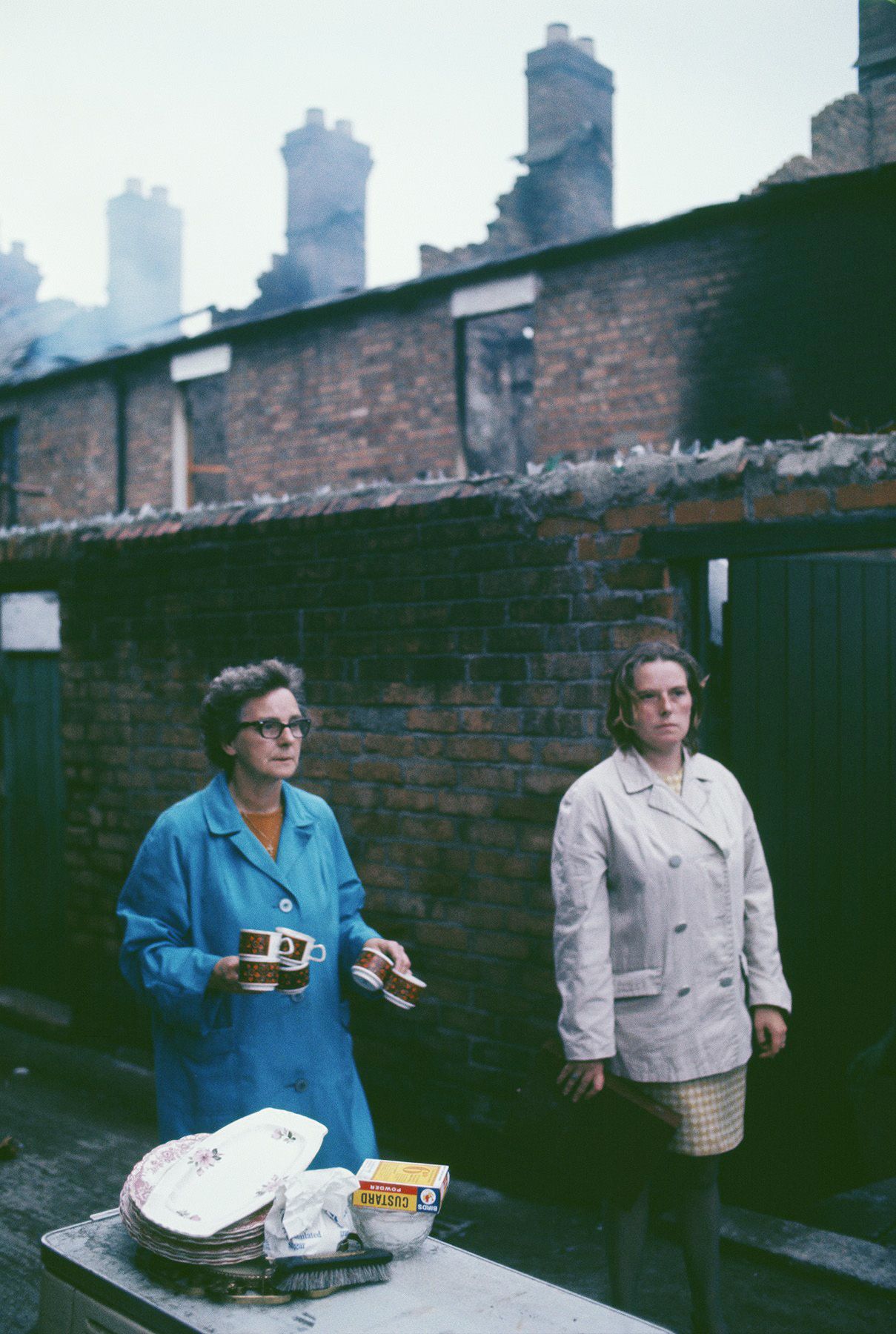 APPEAL: Two women leave their possessions on a table in the alley