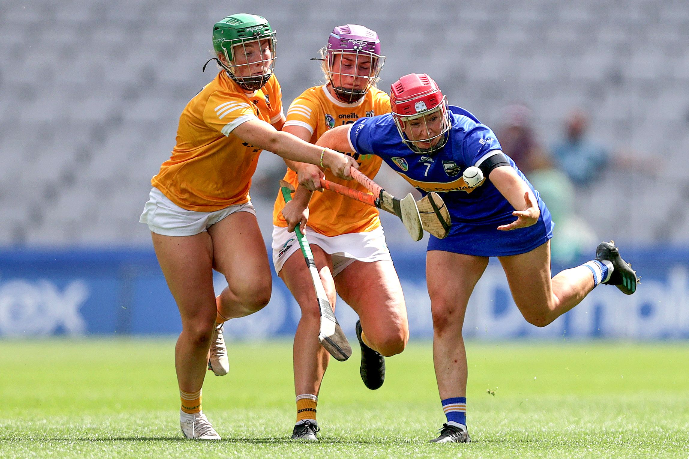 Aoife McGrath gets out in front of Roisín McCormick and Siobhan McKillop 