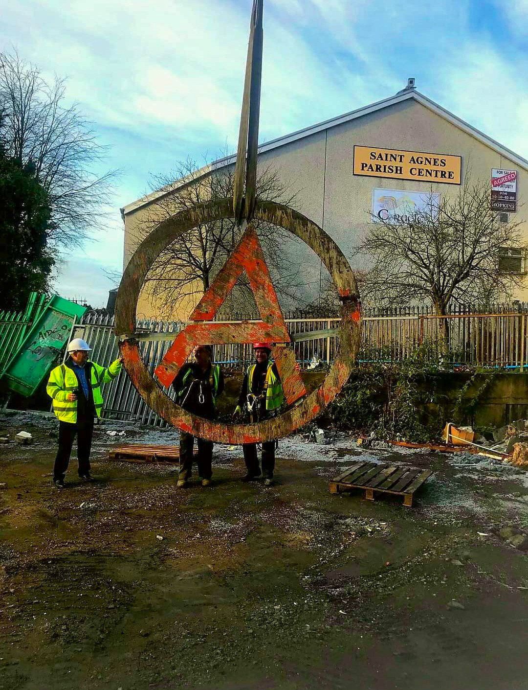 WHAT COMES DOWN: The 'A' sign being removed from the ALC during its demolition. Pic by Cllr Matt Garrett.