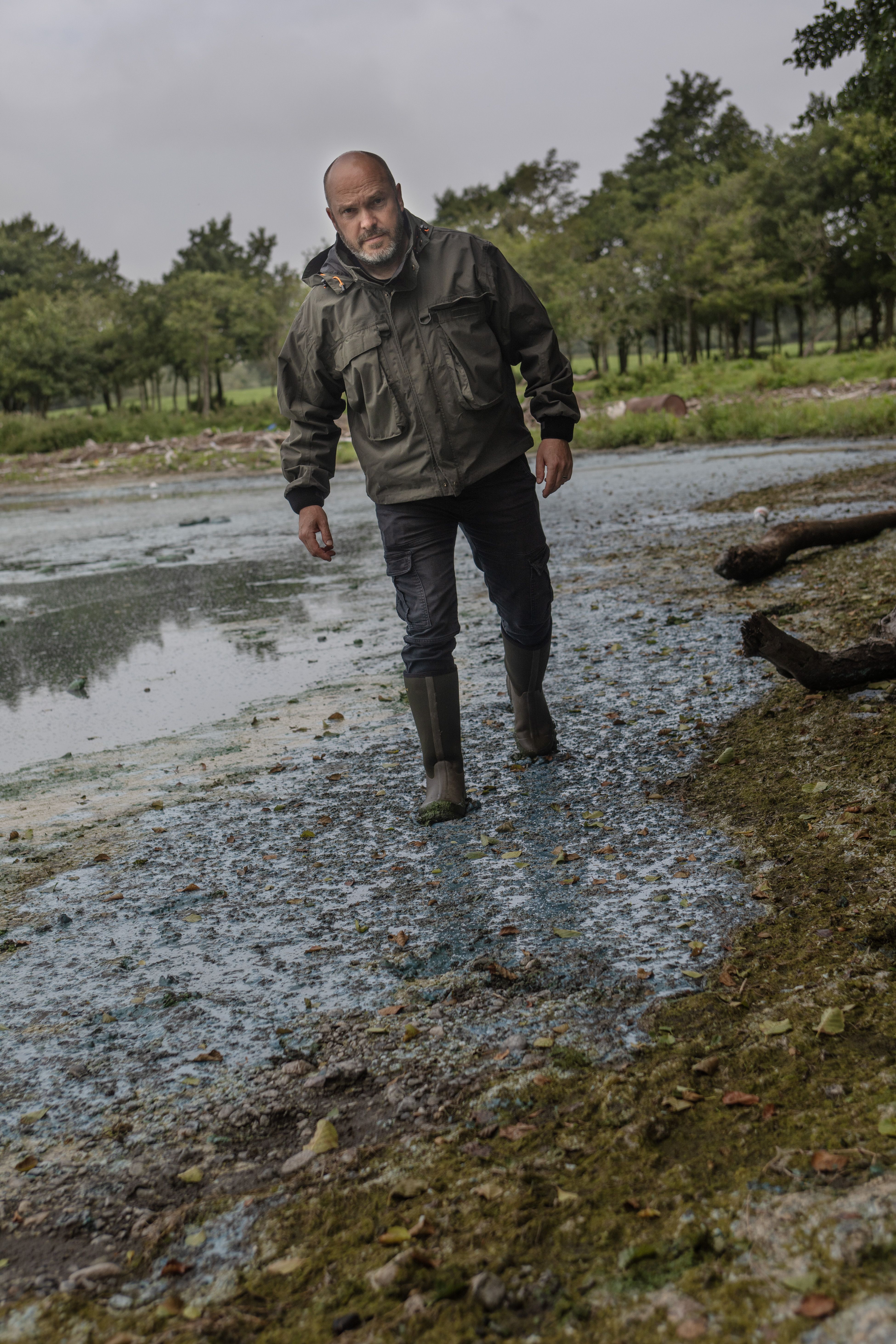 TOXIC: David Kennedy of CDAA demonstrating how thick the Lough algae is 