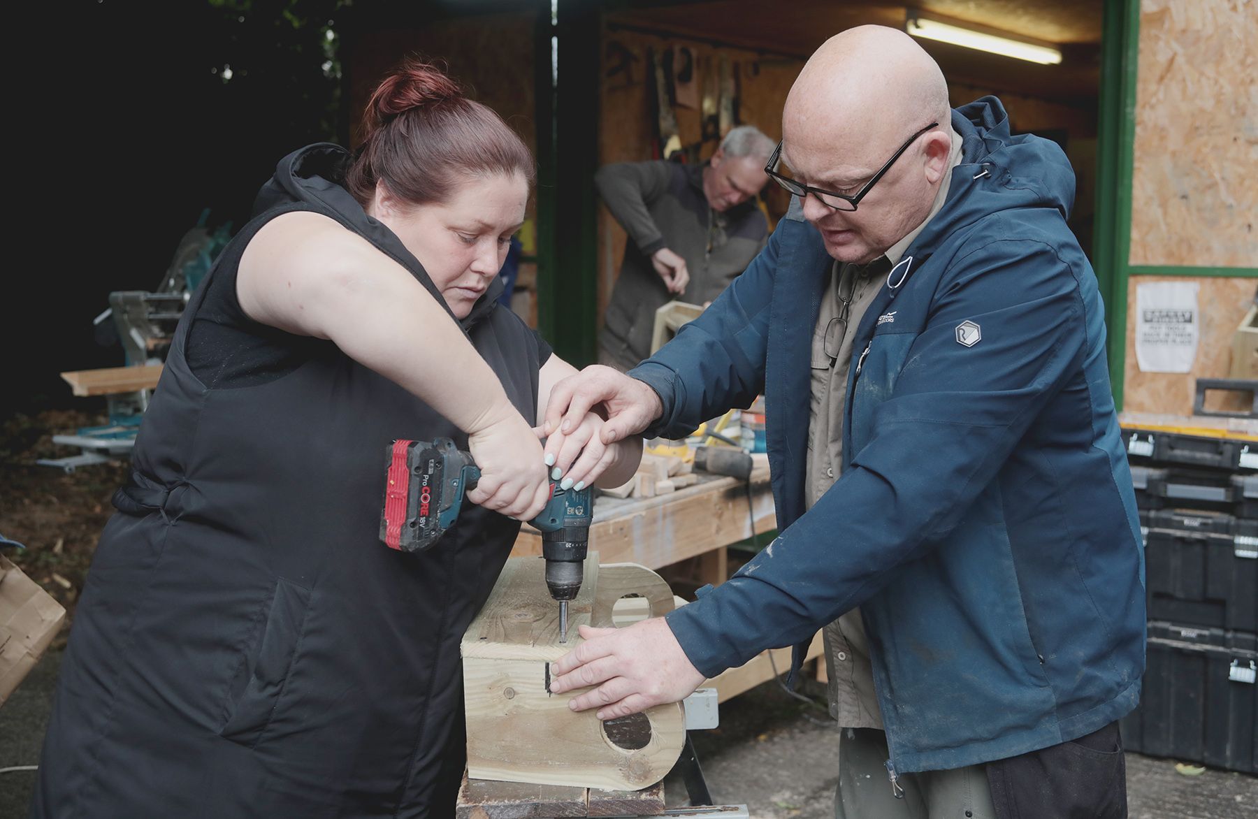 SKILLS: Michael McCorry from Belfast City Council assisting in the making of planters with a member of Tullymore Women's Group