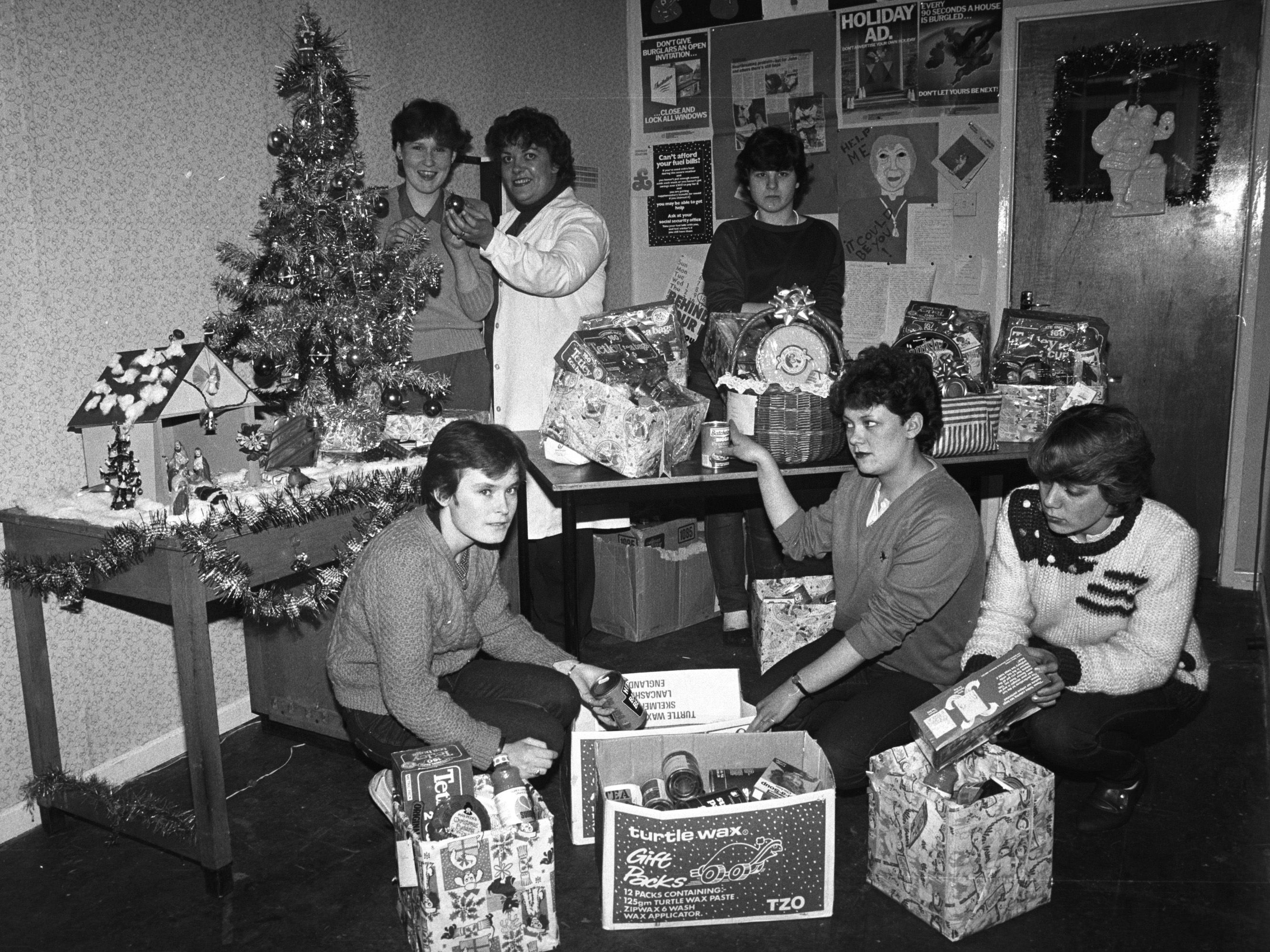 Liz Brown (supervisor) with Community Help trainees Jackie, Catherine, Geraldine, Deana and Marie prepare Christmas hampers for the elderly