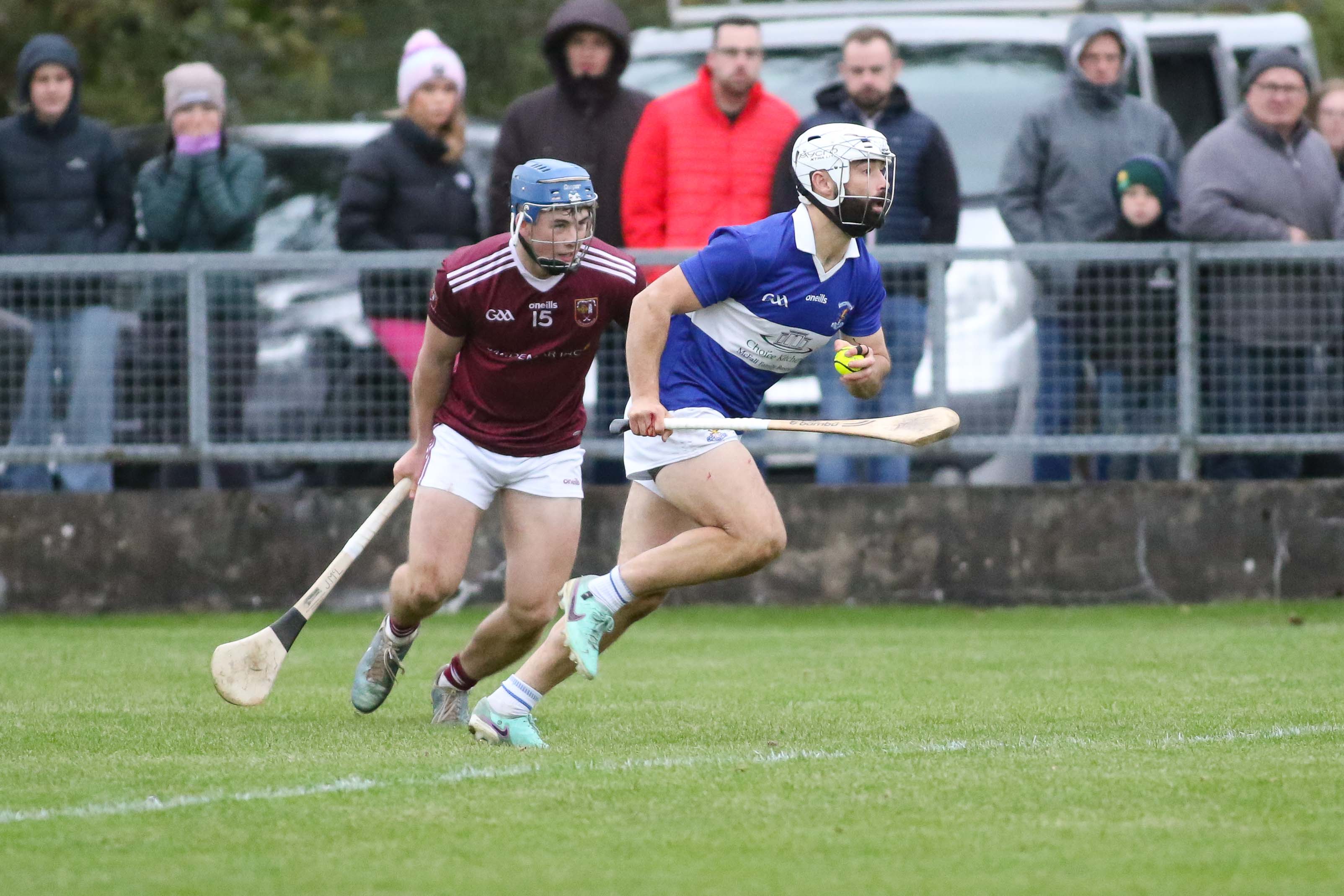 Ciaran Johnston bursts past Jospeh McLaughlin