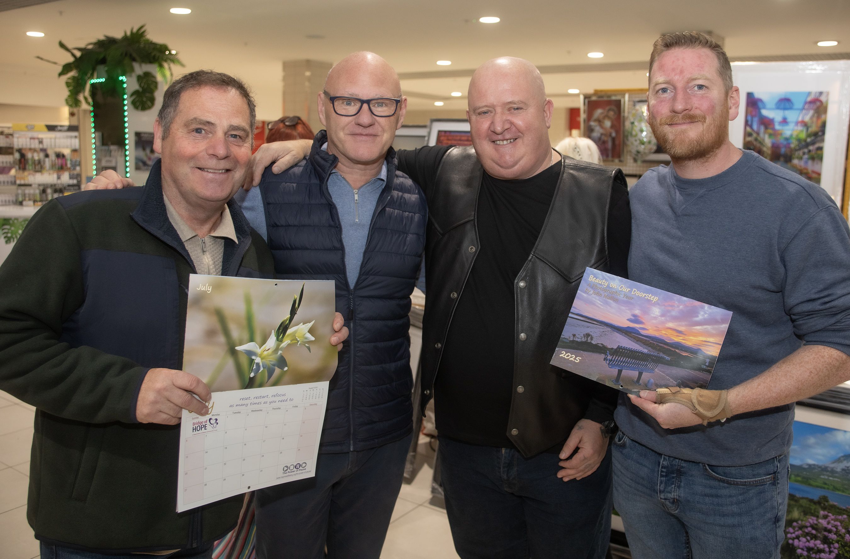 Philip McTaggart, Paul Maskey MP, John Mallon and Councillor Tomás Ó Néill