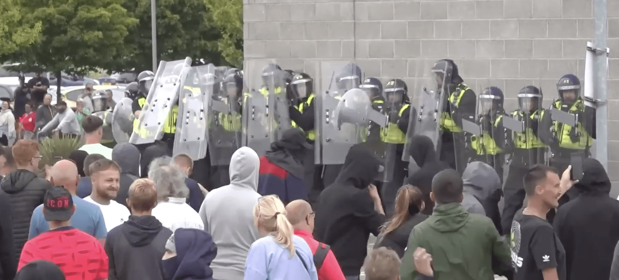 DETERMINED: A mob tries to gain access to a Rotherham hotel housing migrants