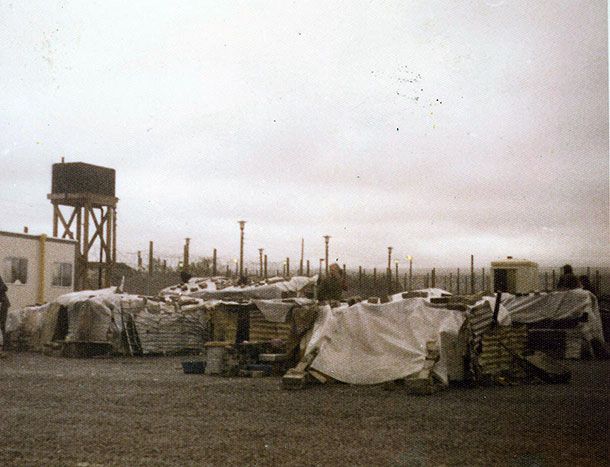 CONDITIONS: After the burning prisoners and internees lived in makeshift huts and dug a tunnel out of one of them CONDITIONS: After the burning prisoners and internees lived in makeshift huts and dug a tunnel out of one of them