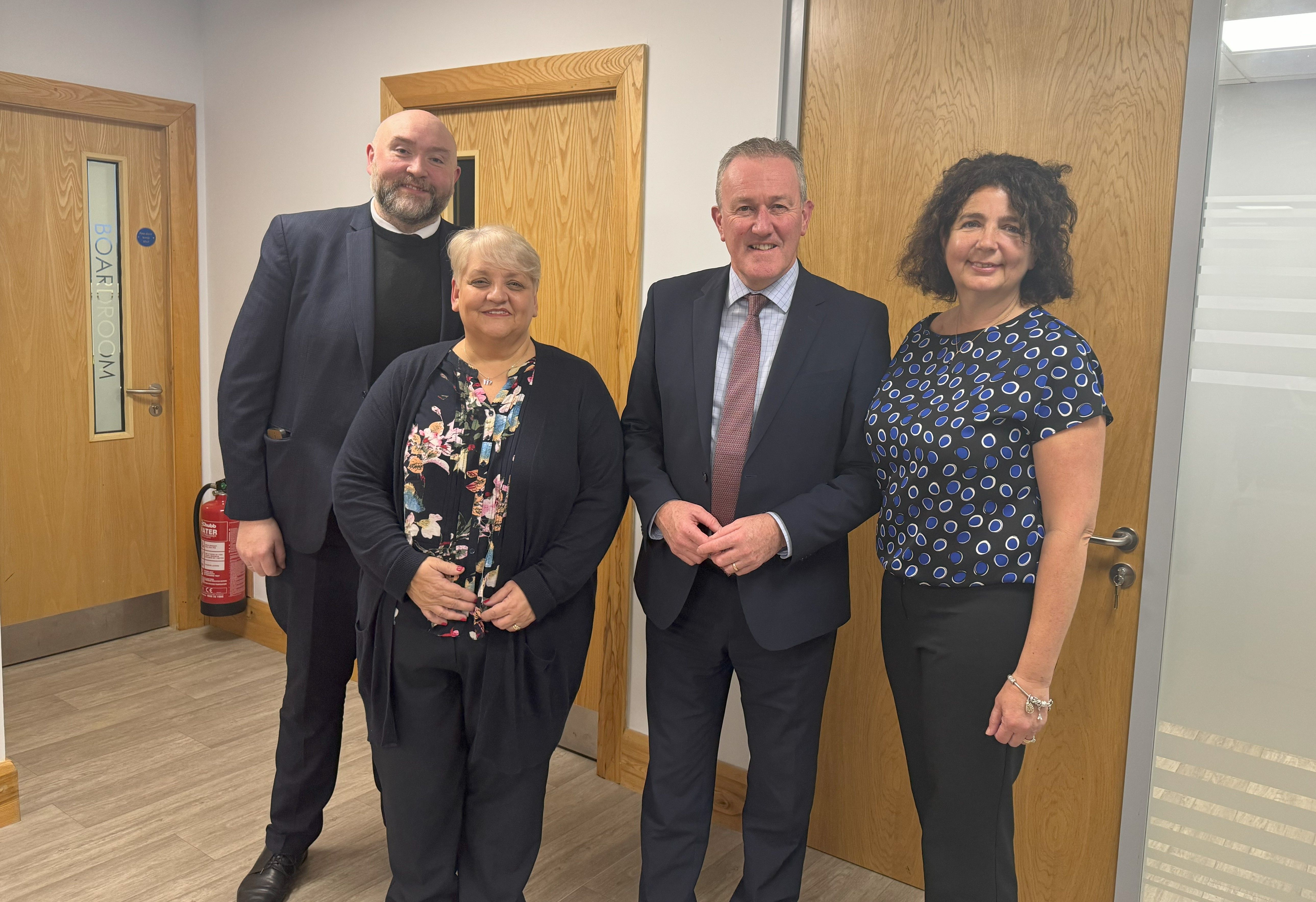 FÁILTE: Left-to-right; Martin Fisher, Irish League of Credit Unions; Marcella McNeill, chairperson of the Board of Directors at SAG Credit Union; Economy Minister Conor Murphy; and Sheena Joyce, SAG Credit Union manager