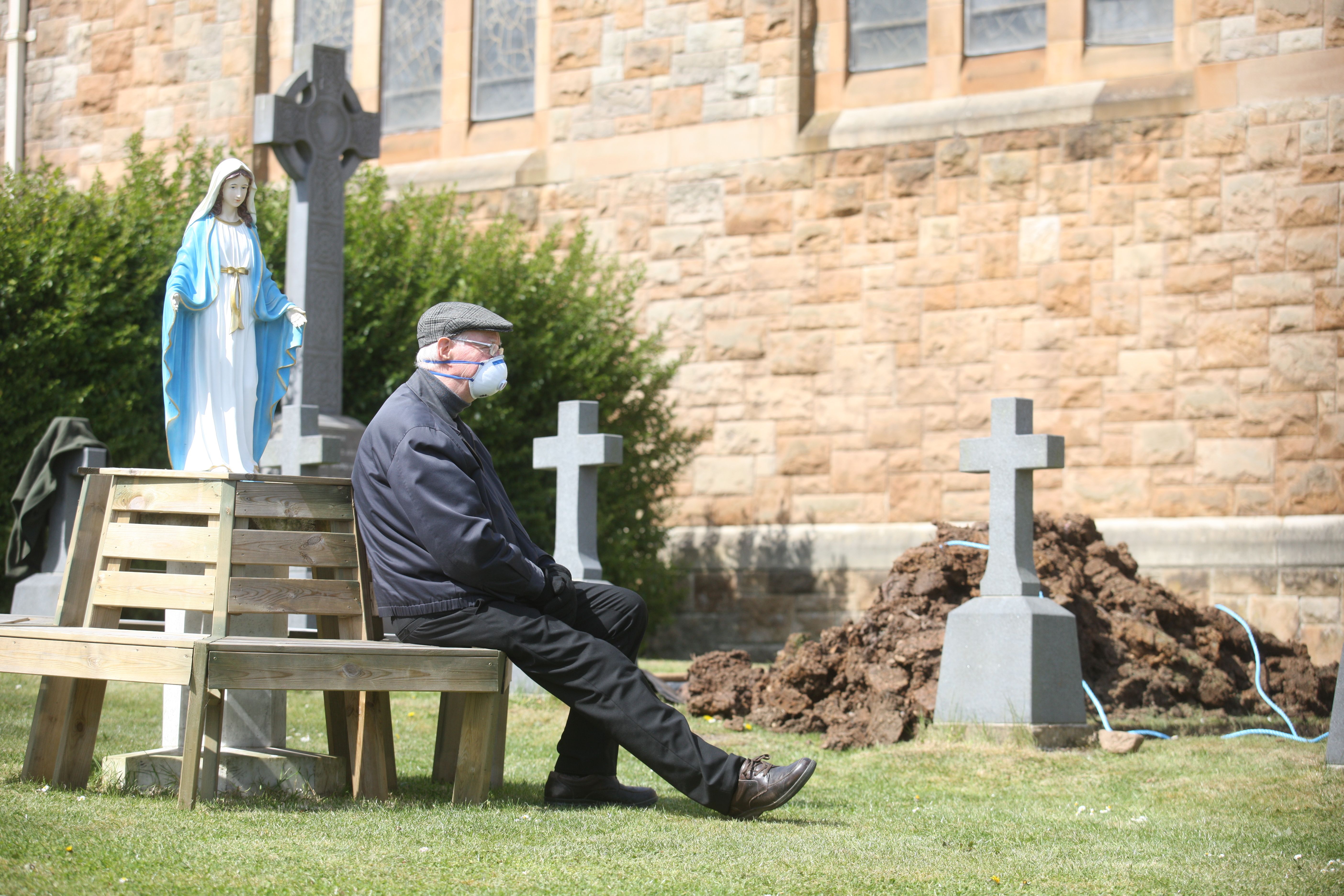 REMEMBERED: Fr Myles attending a funeral during lockdown