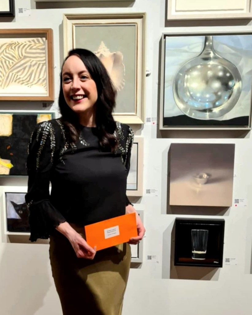 A delighted Hannah O'Hagan with her award and her award-winning piece of art