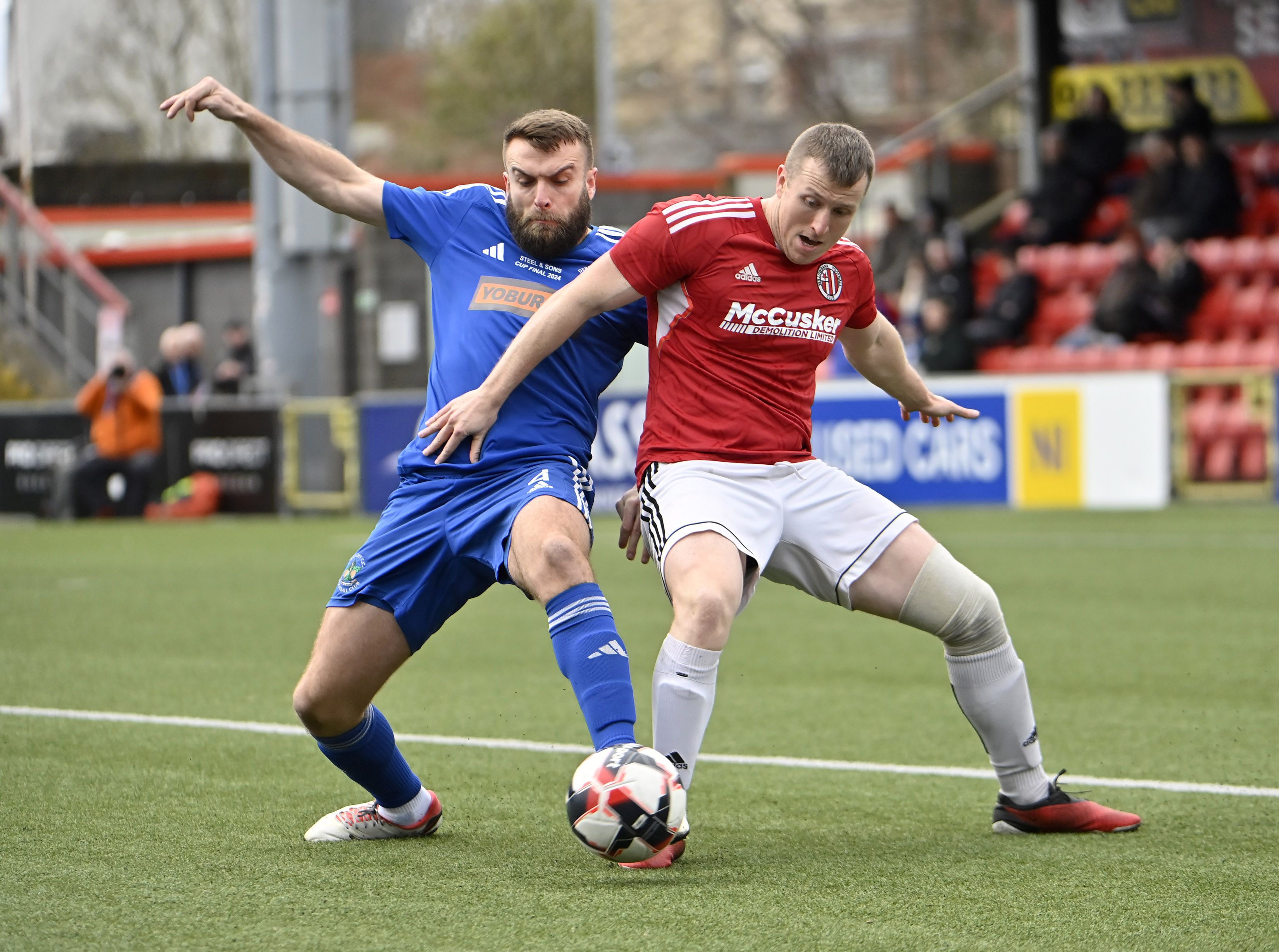 Willowbank's Thomas McCrory is challenged by Barry Moore