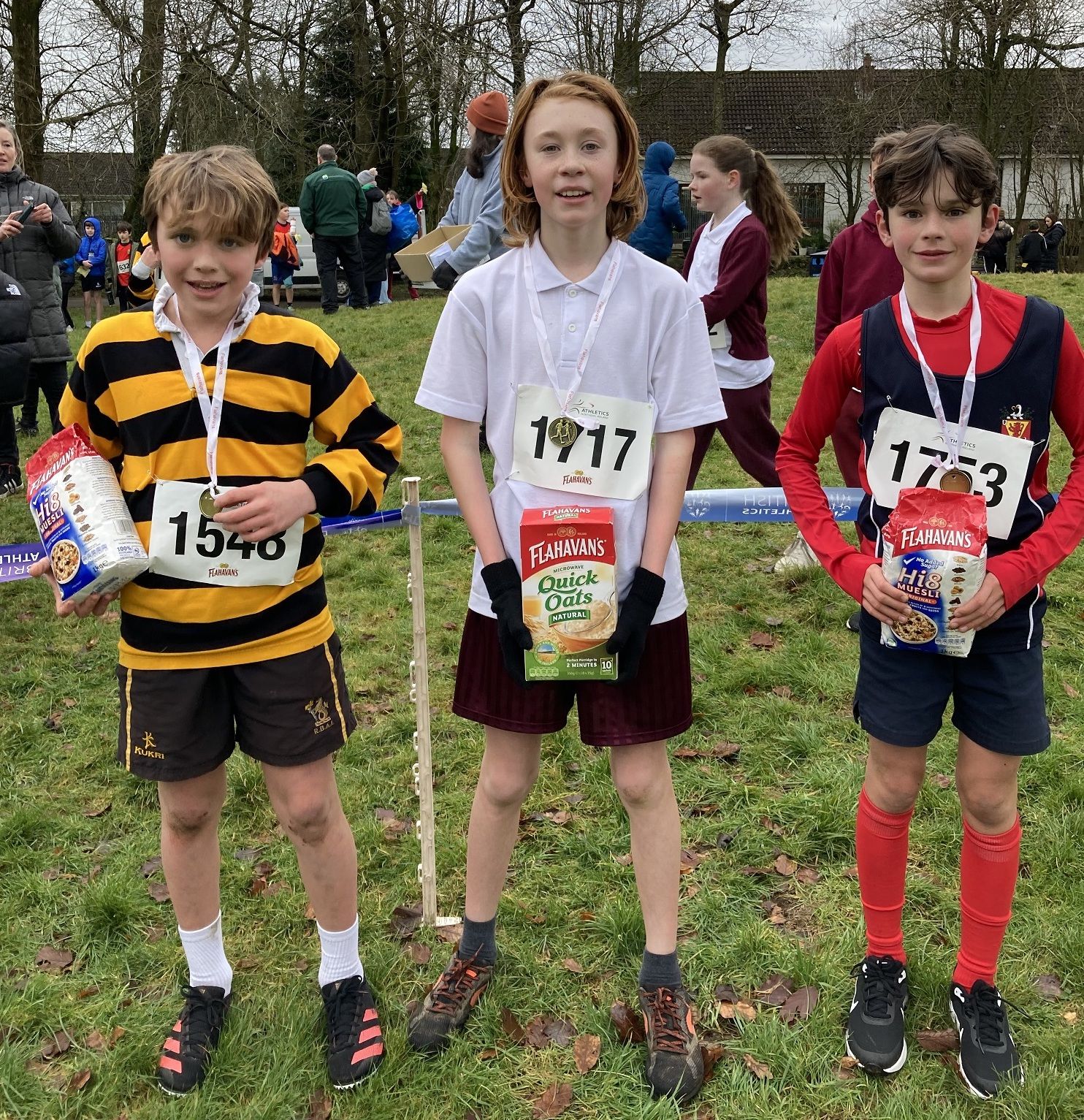 Tom McMurray in second place, Cillian McLoughlin in first place and Leo McClinton in third place in the second boys’ race