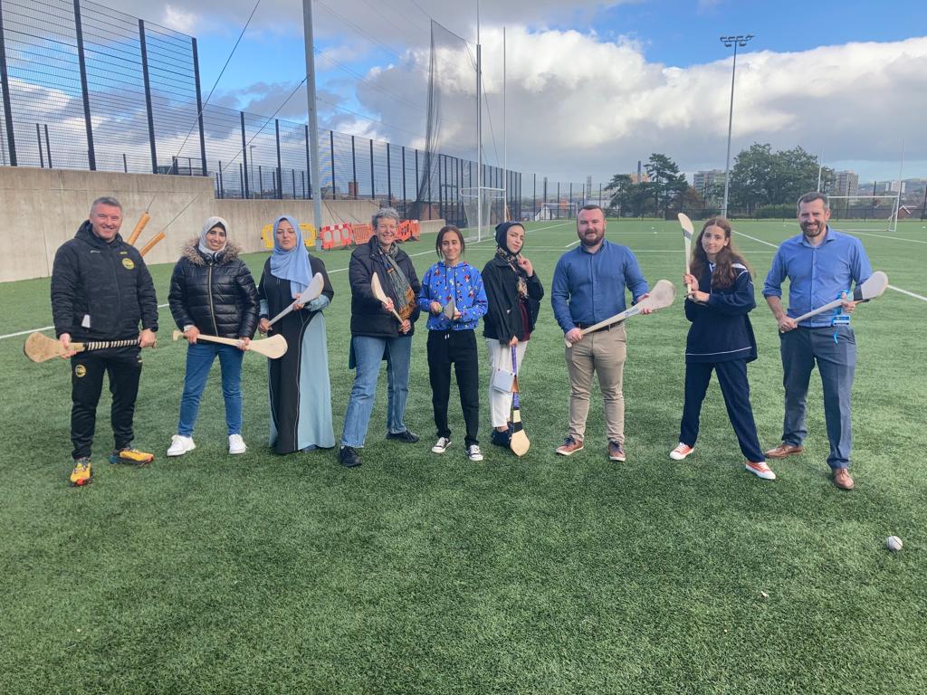 The girls learning camogie at Coláiste Feirste