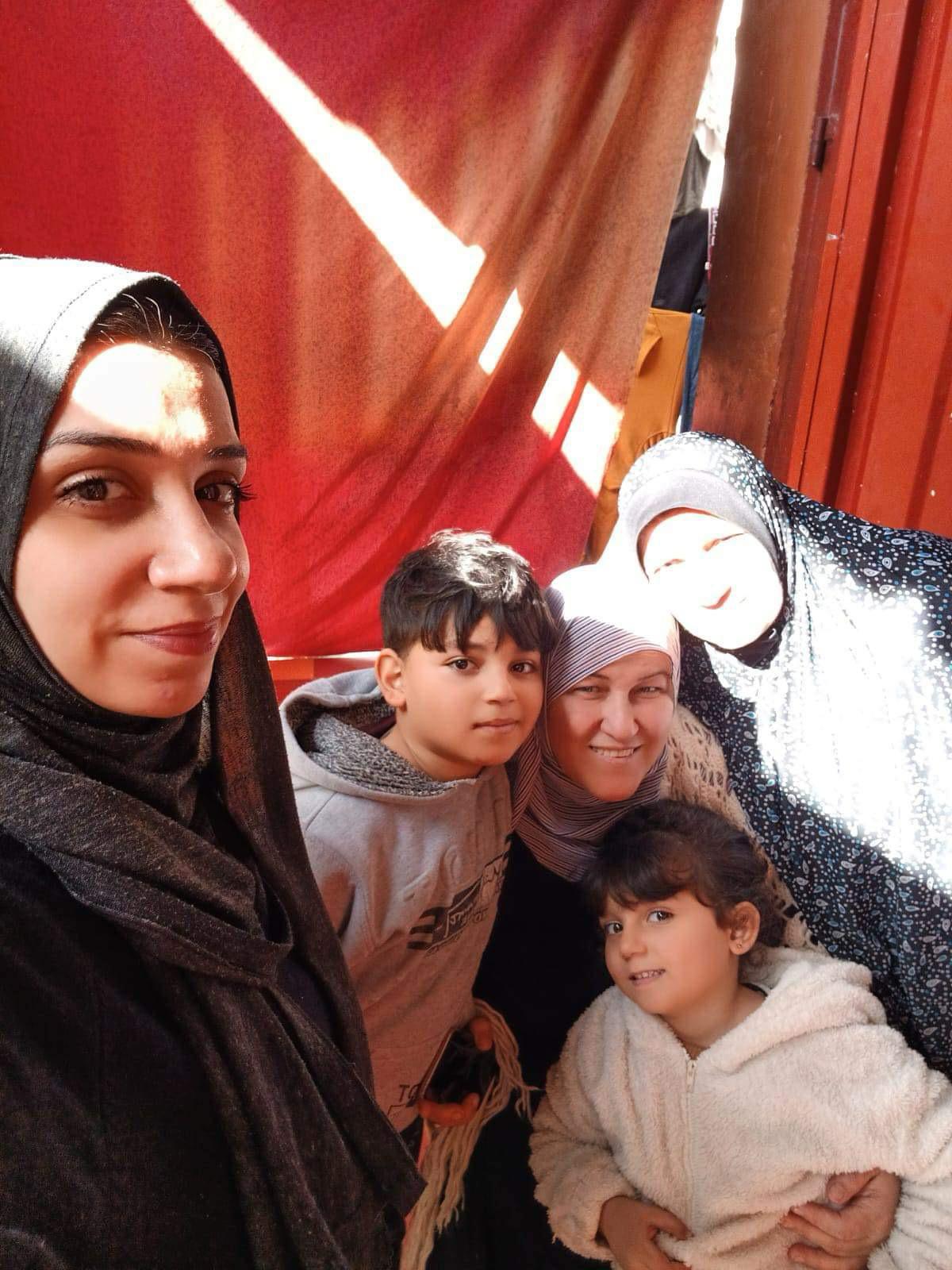 The brothers' family are living in a tent in Rafah – pictured is their mum, granny, two sisters and brother