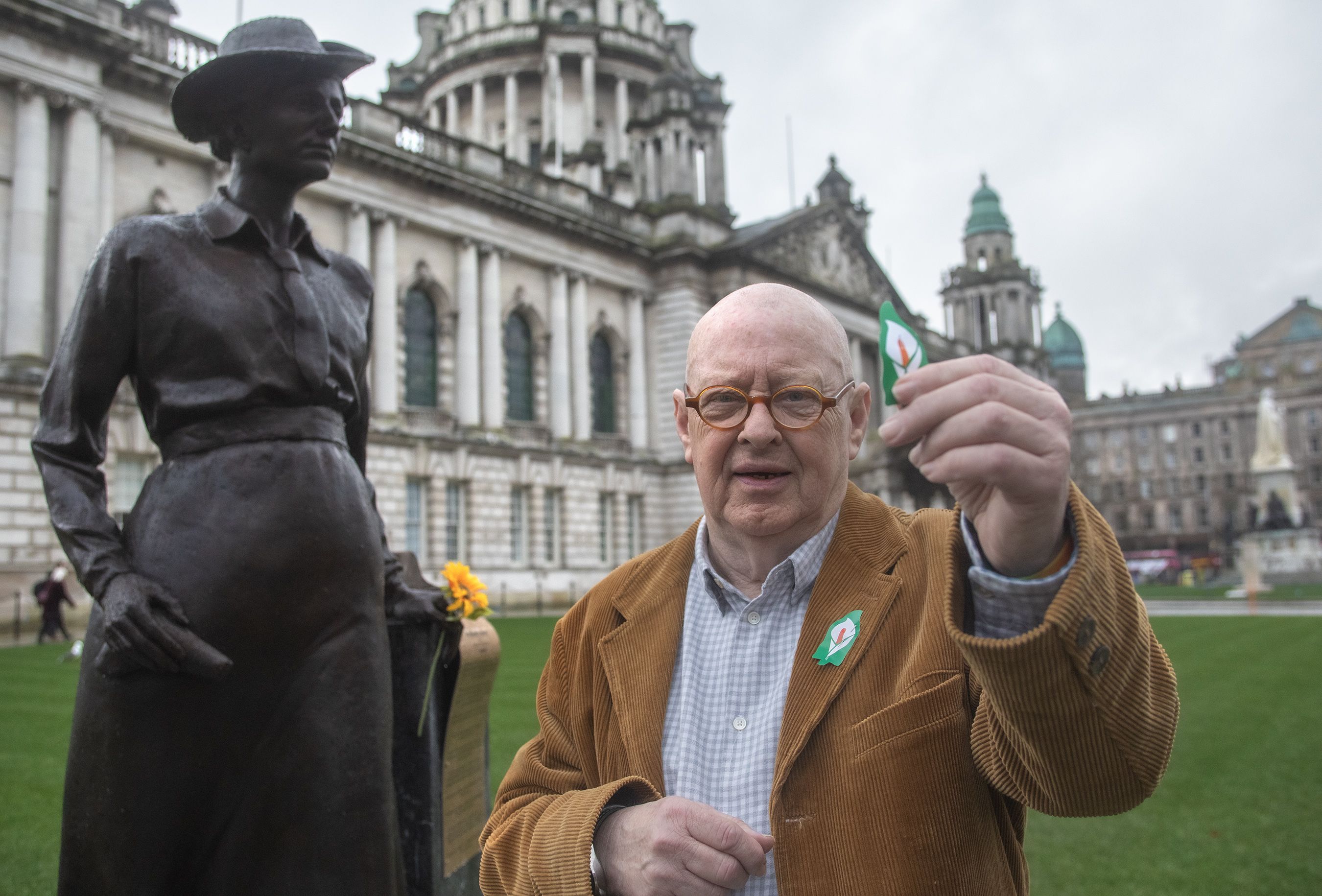 TRIBUTE: Joe Austin with an Easter lily in front of the newly unveiled statue of Republican, socialist and trade union activist Winifred Carney