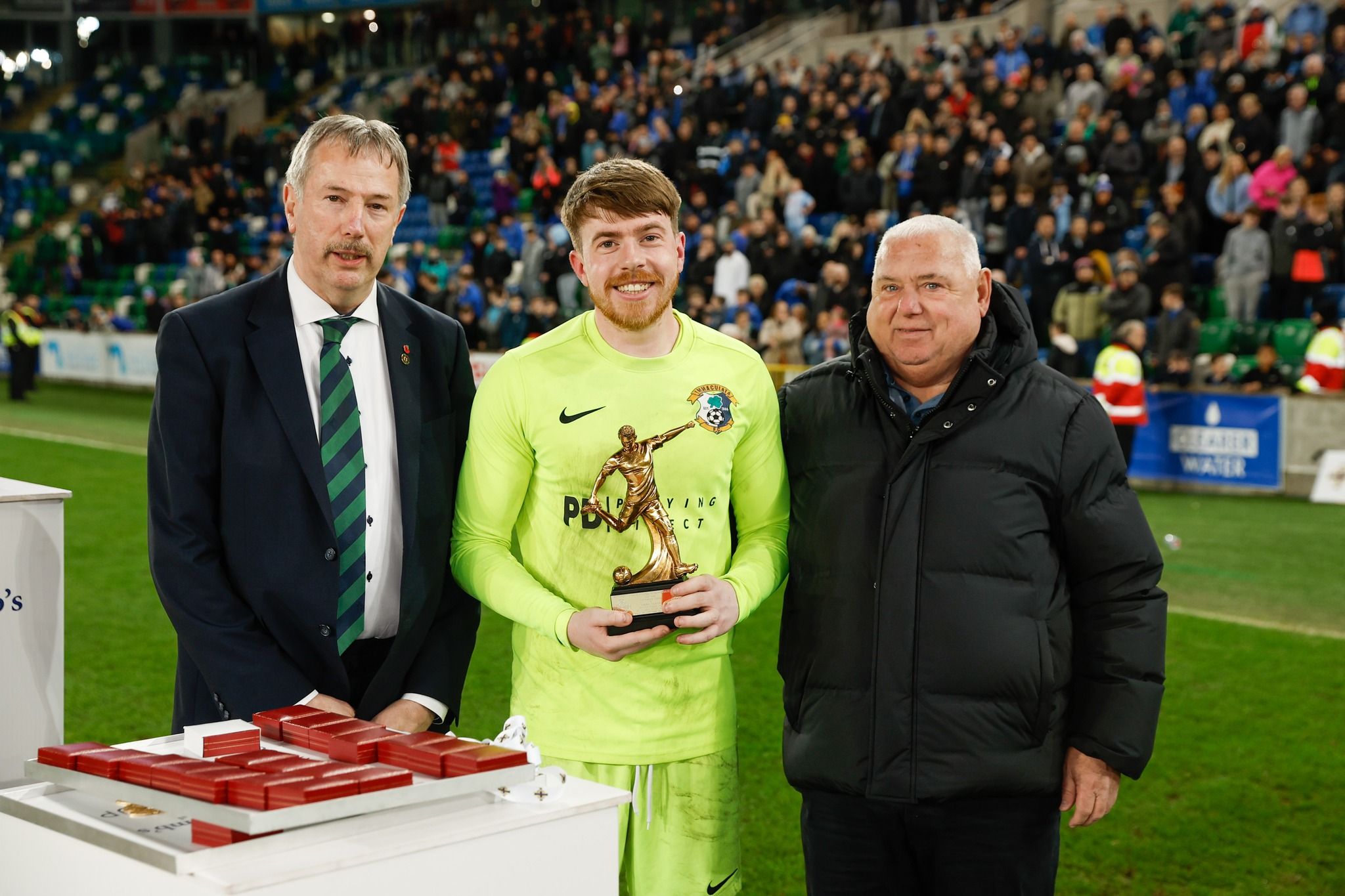 Goalkeeper Ruairi Murray collects the man-of-the-match award