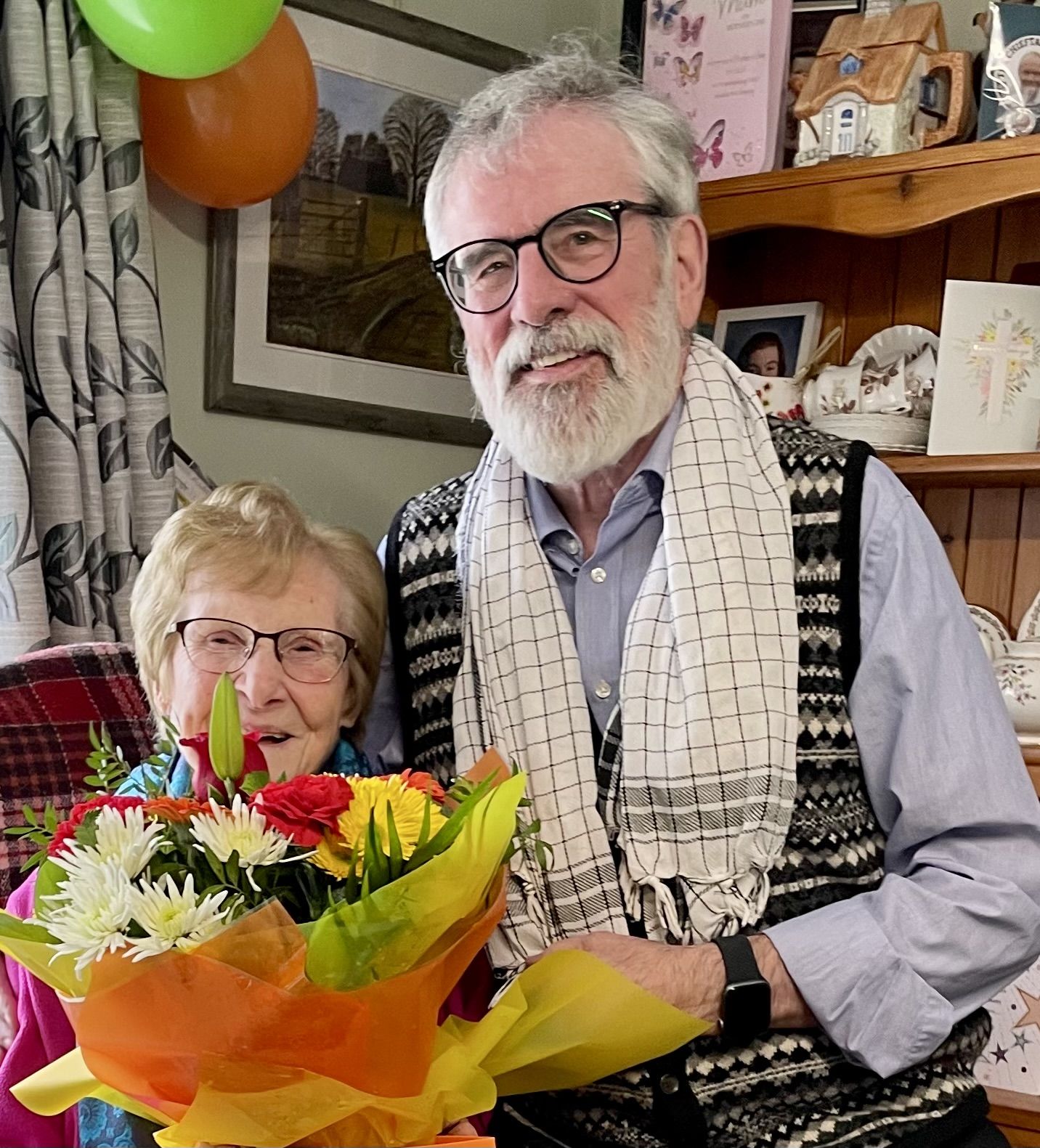 CENTENARIAN: Maisie Moley with a birthday bouquet from Gerry Adams