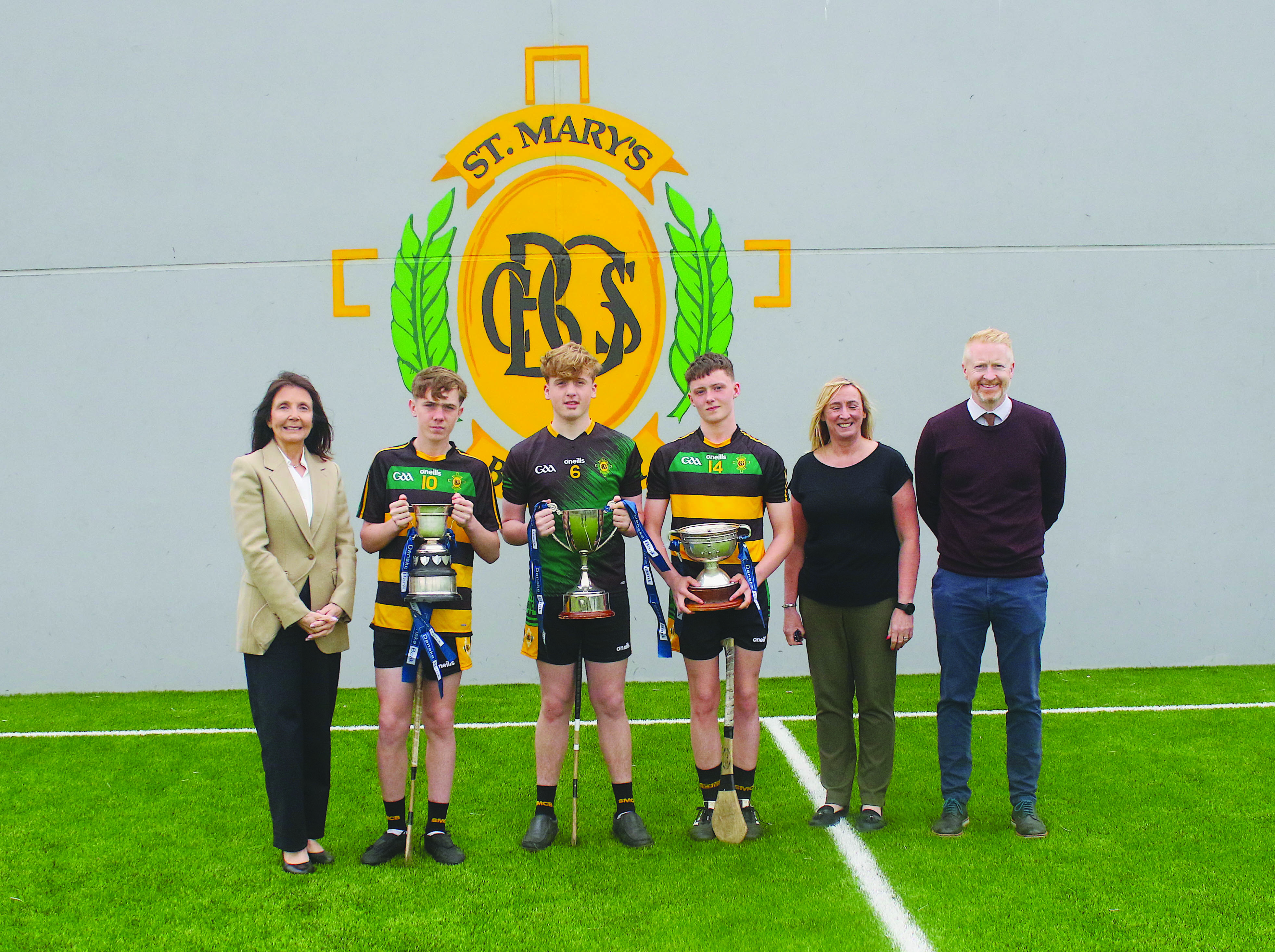 The winning captains with outgoing principal, Mrs Siobhan Kelly; outgoing vice-principal Mrs, Fiona Crookes; and incoming principal, Mr Brendan McComb