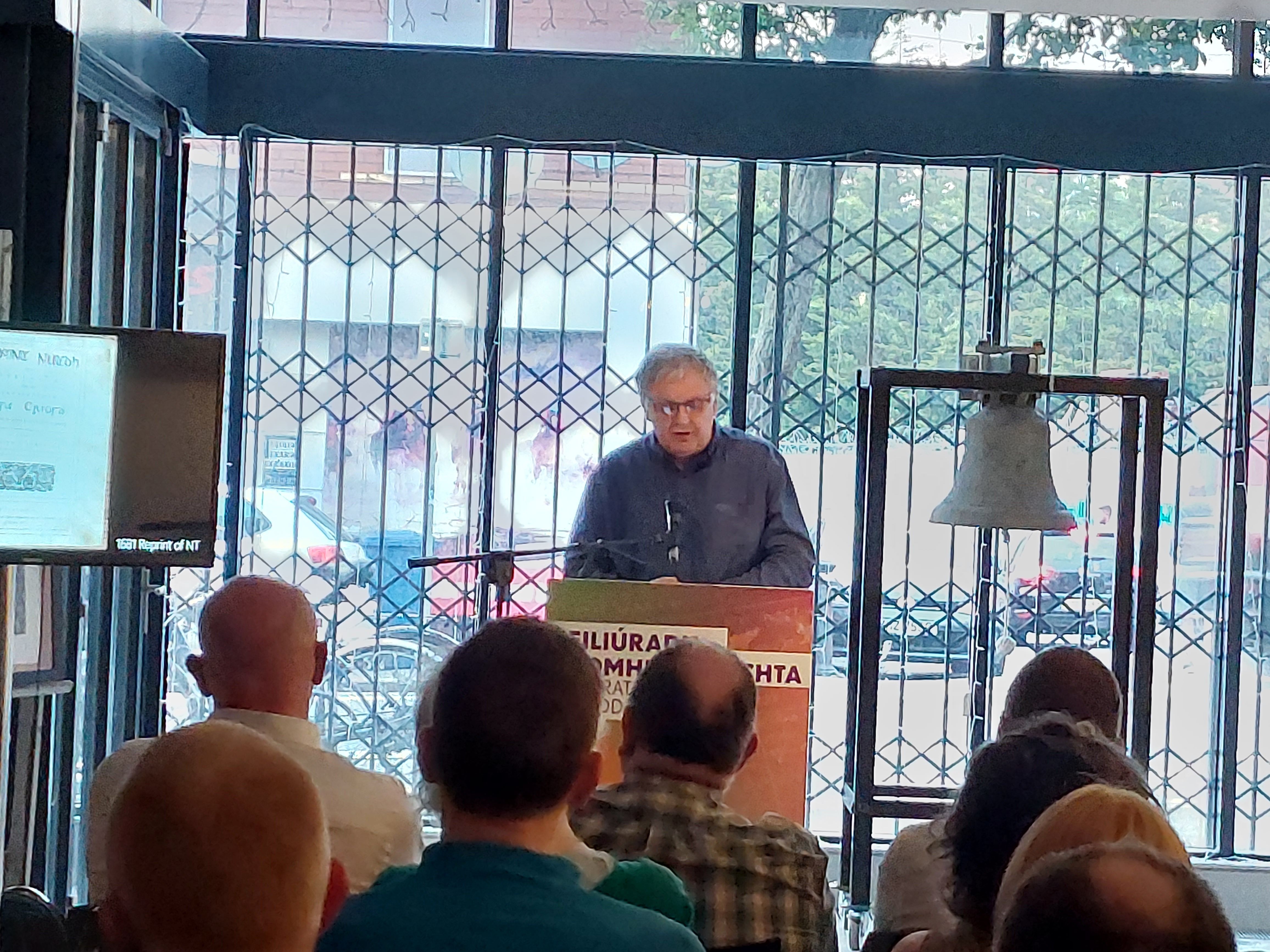 John Duffy giving his talk with the original bell behind him from when the Cultúrlann was a Presbyterian Church