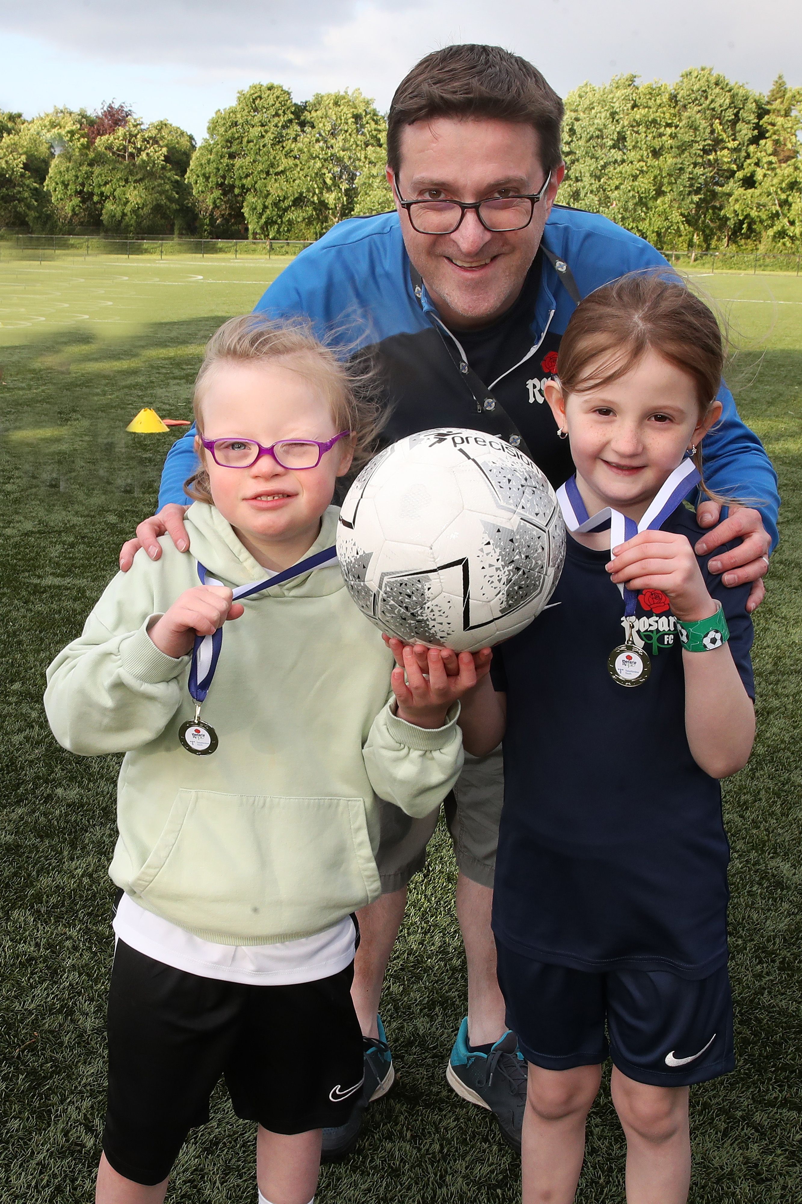 Peter Leonard with Ciara Gibson (left) and Esme McCann (right), two club members