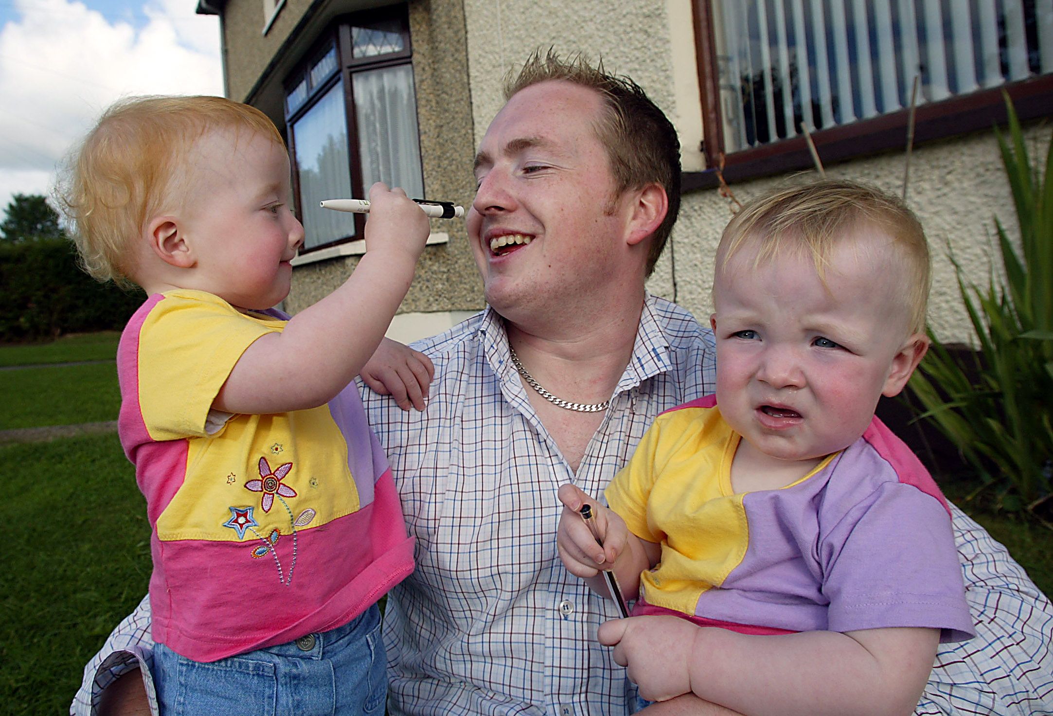 SEEING DOUBLE: Kevin Grieve with twins Katie and Jane back in 2002