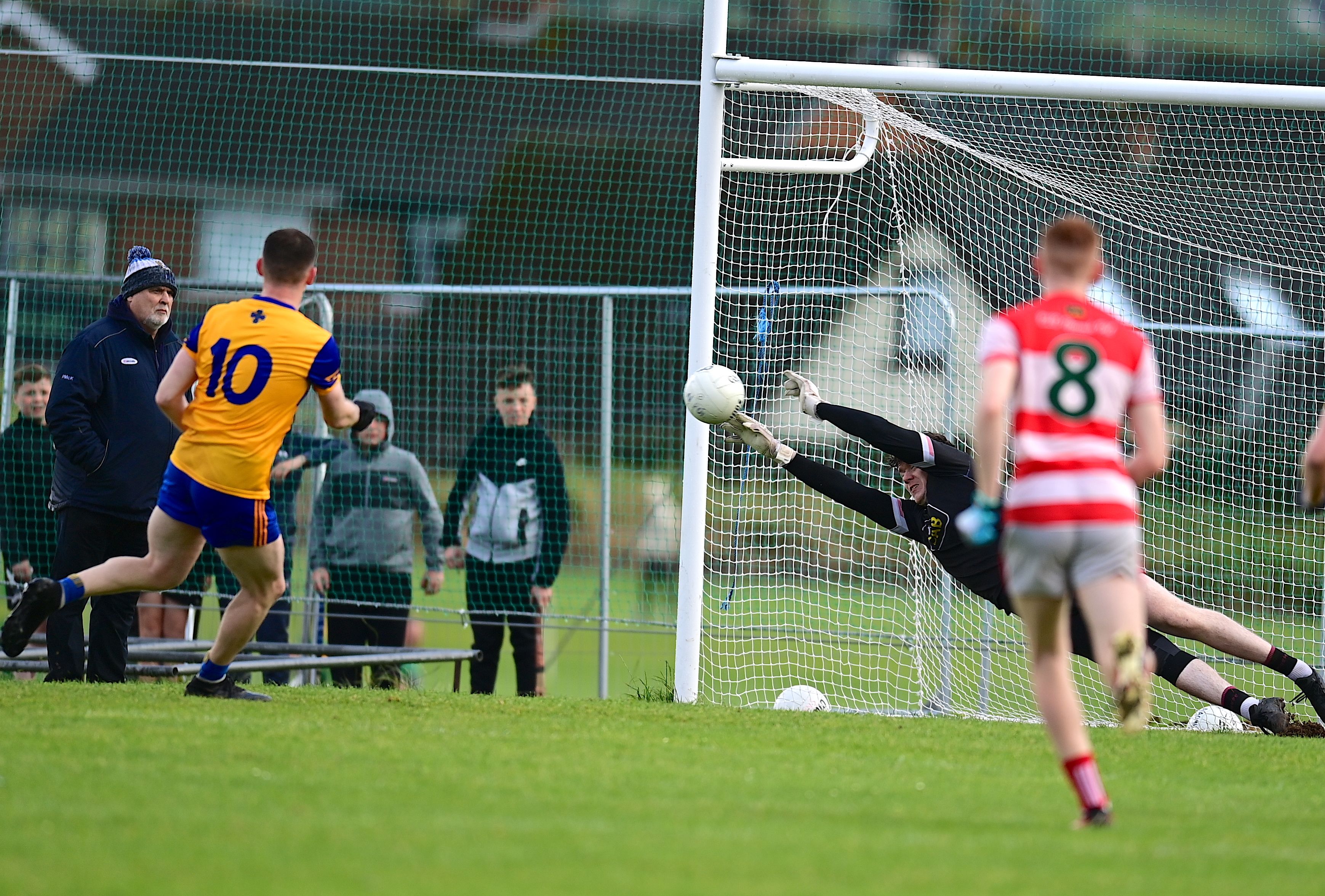 Jack McAufield saves Jay Mallon's penalty 