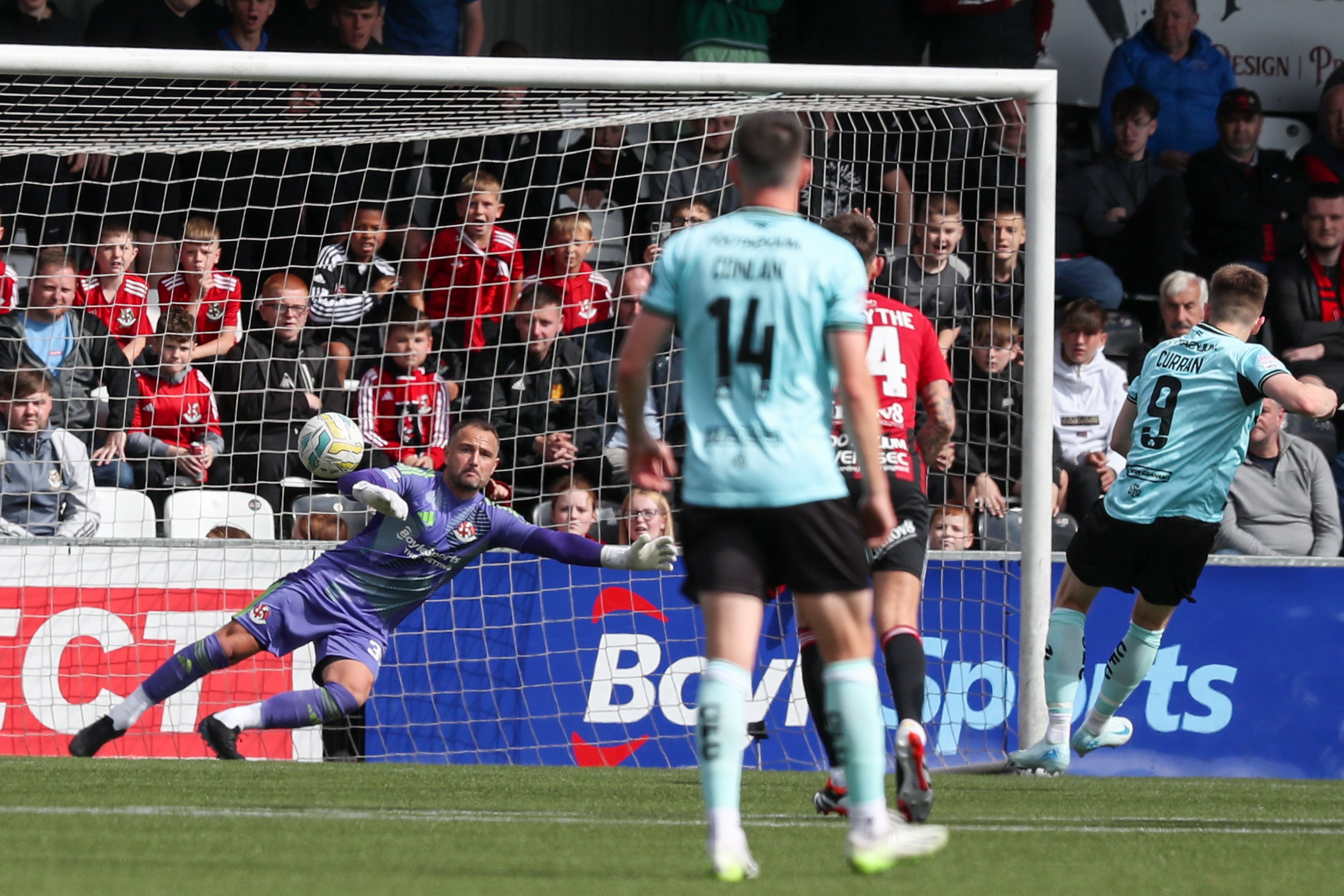Ryan Curran scores his penalty