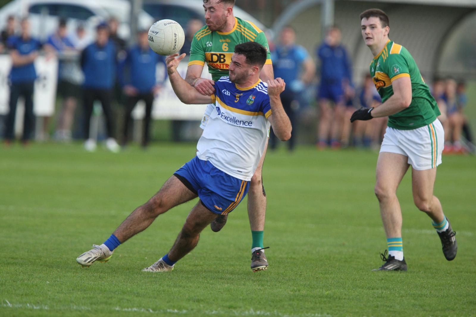 Reuben Carleton goes down as Deaglan Smyth challenges 