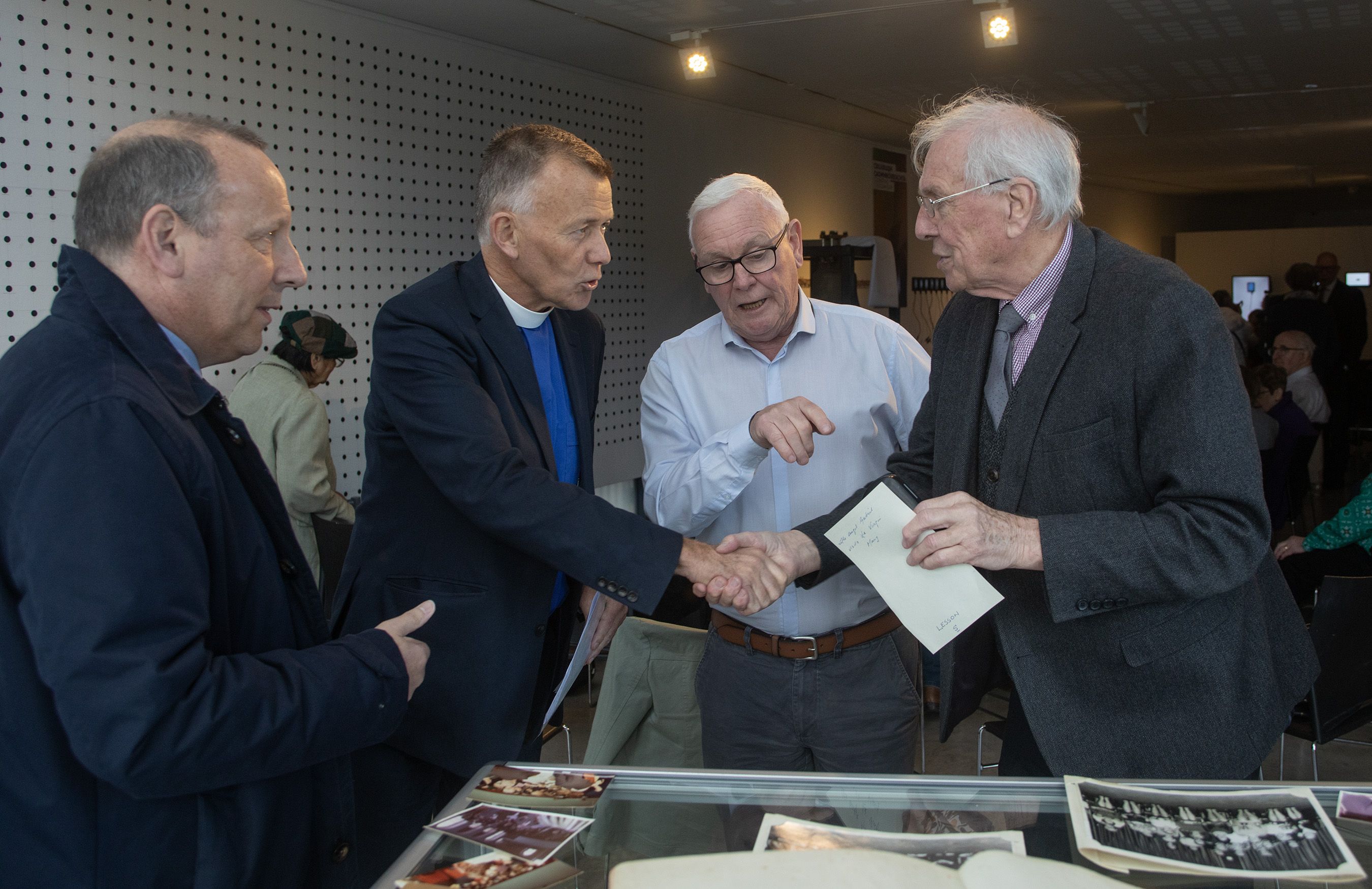 FÁILTE: Jake Mac Siacais, centre, shows Moderator Richard Murray, Presbyterian artefacts on display at the Cultúrlann