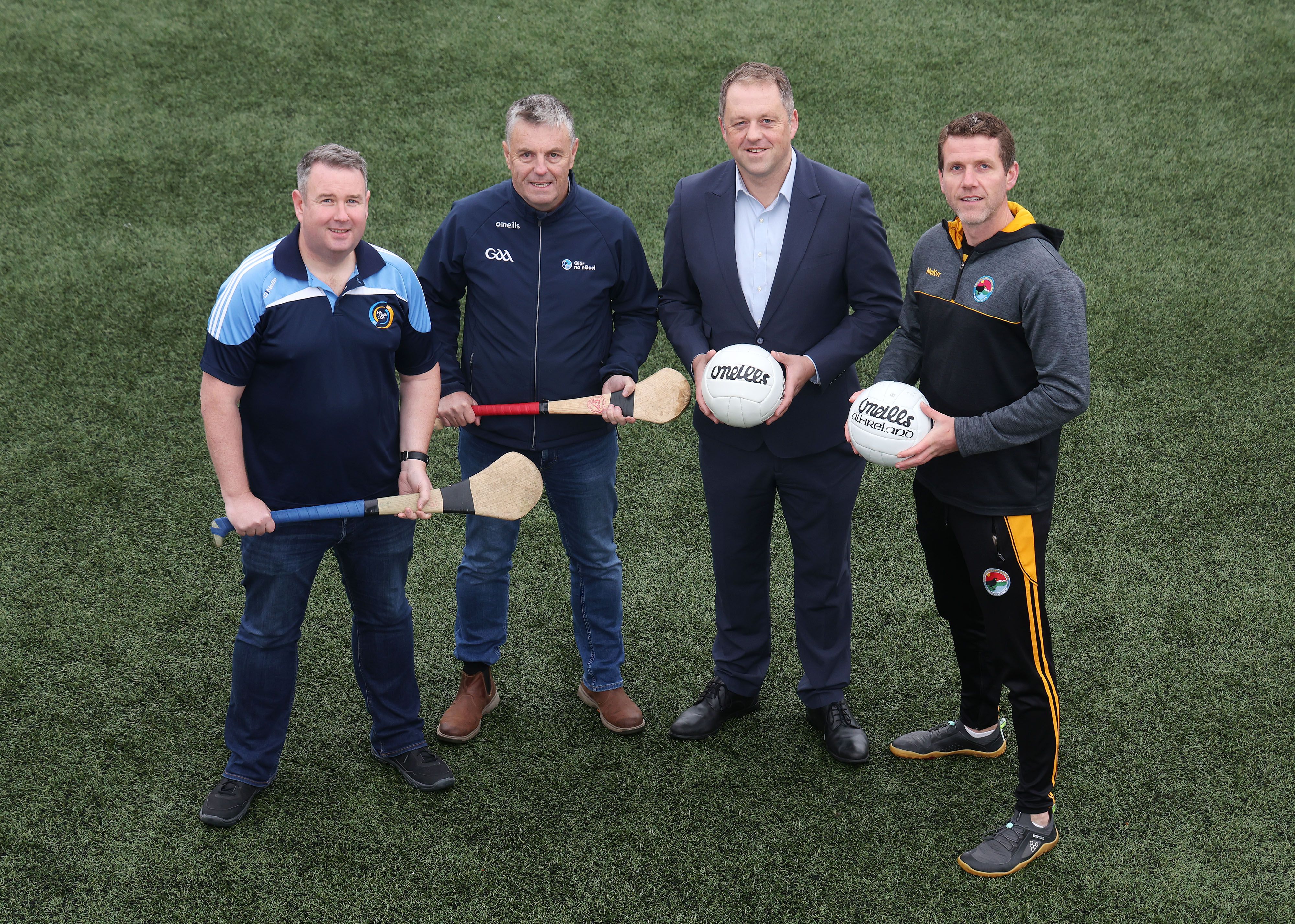 Minister for State Thomas Byrne TD, Ciarán Mac Giolla Bhéin, Chairperson, CLG Laochra Loch Lao, right