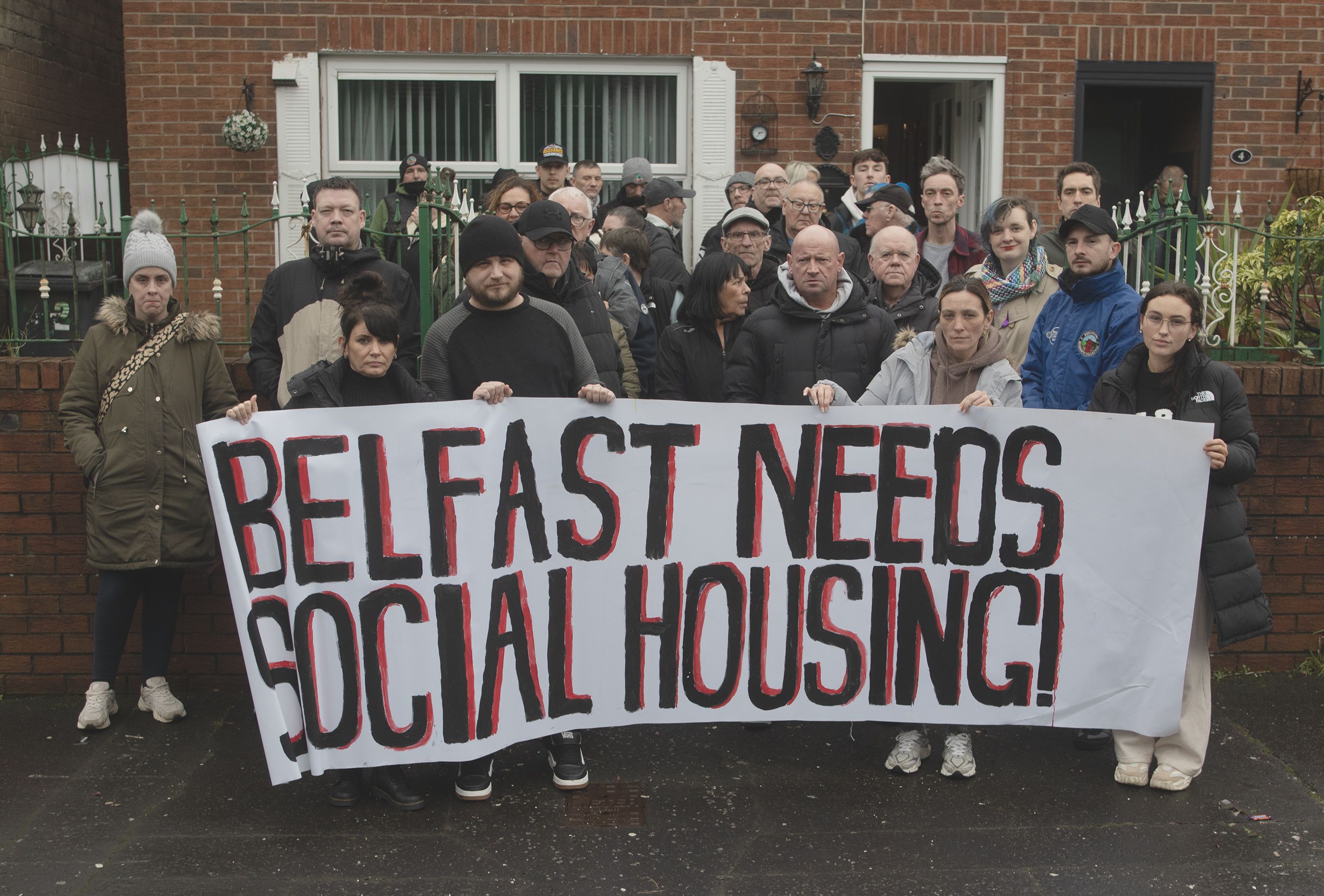 Neighbours and community reps outside the Waterford Street home