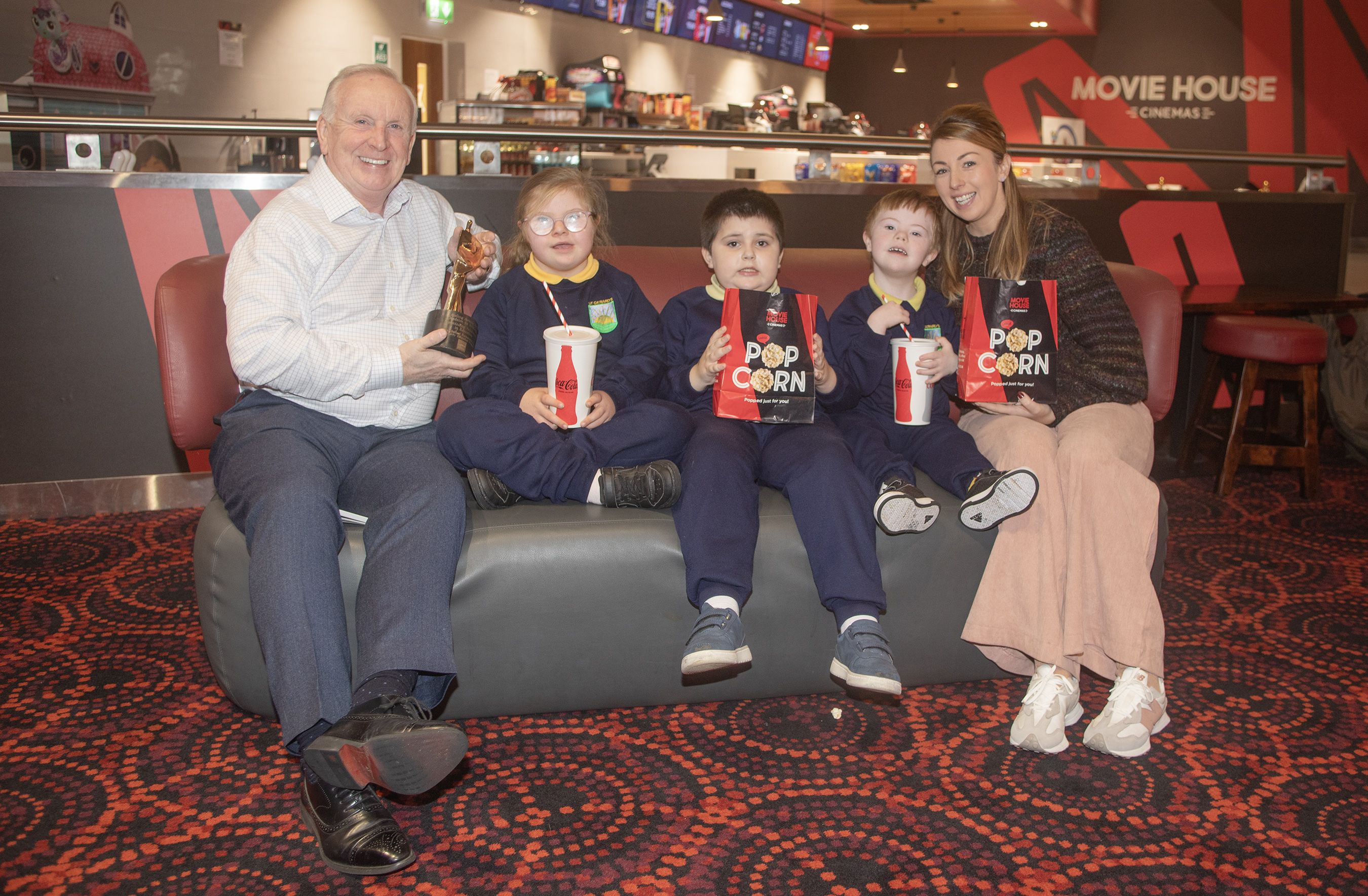 COMMUNITY AWARD: Michael McAdam from sponsor Movie House with Arianna, Conor, James and Nuala O’Prey at the cinema 