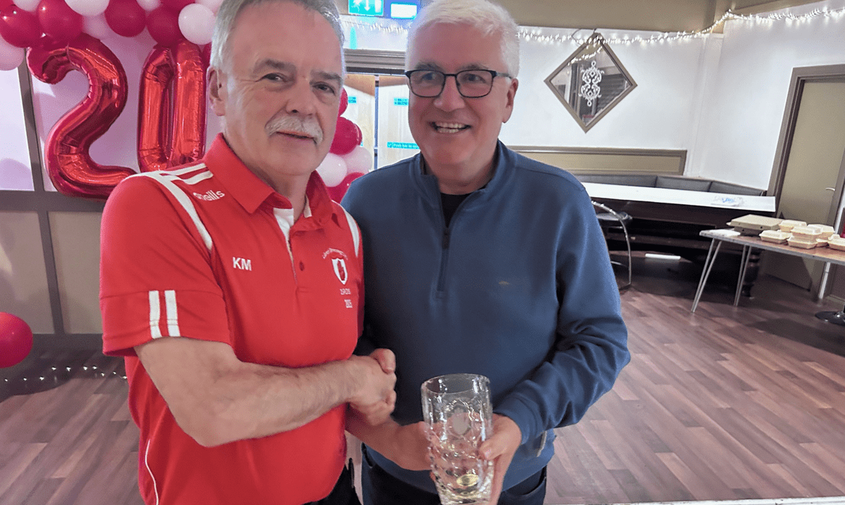 Kieran Megraw receives an award for his contributions to Lámh Dhearg LGFA