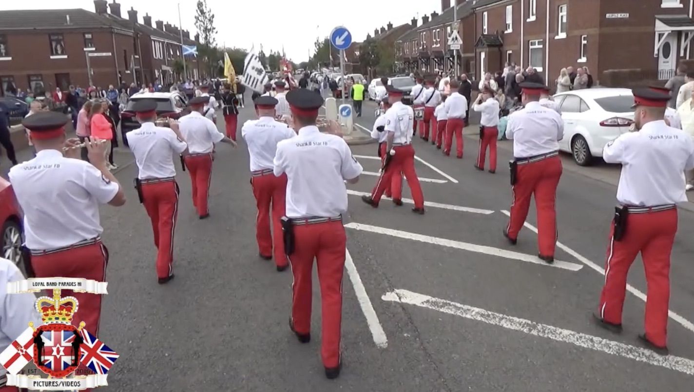SUCCESSFUL: Shankill Star marching in the memorial parade for UVF killer Brian Robinson – they've been given £10,000 for new instruments by the Arts Council