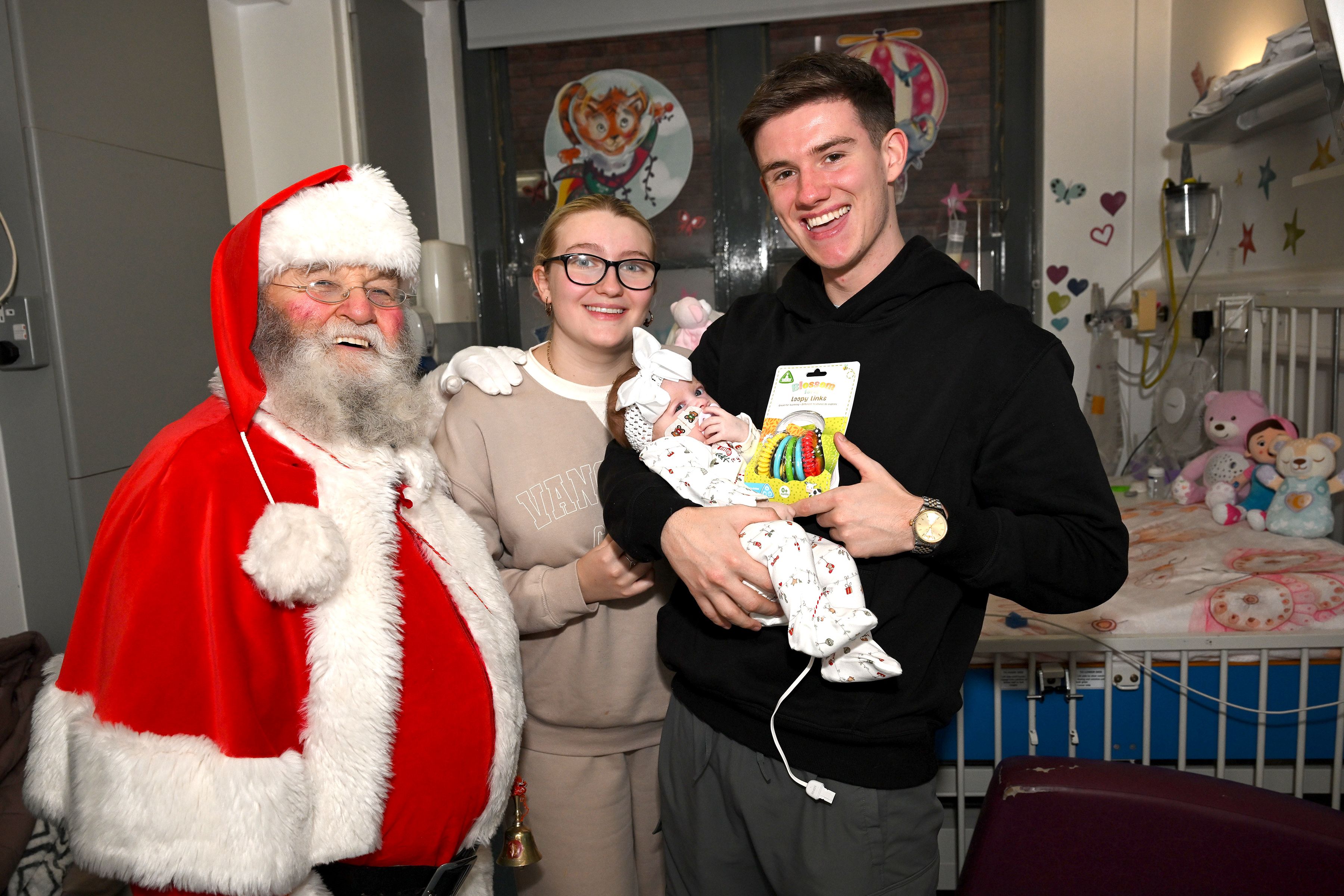 Santa Claus with baby Mireya McDermott and her parents