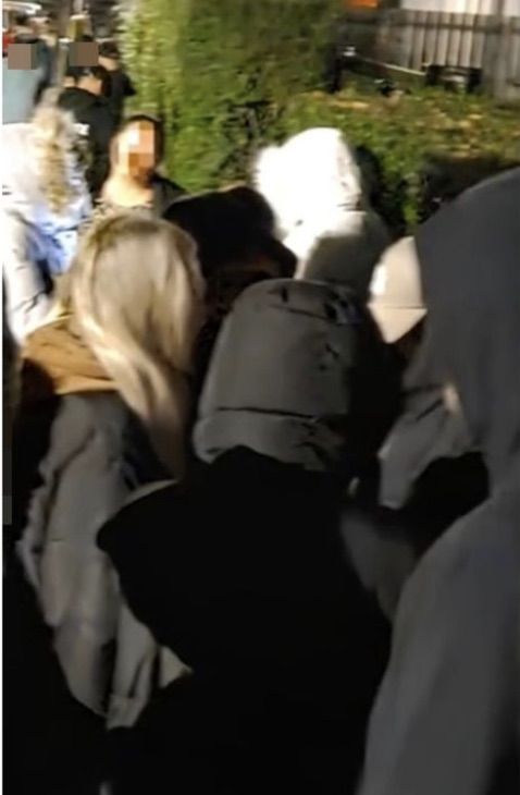 THREATENING: A number of masked loyalists last month gathered outside the East Belfast home of Naomi and Michael Long