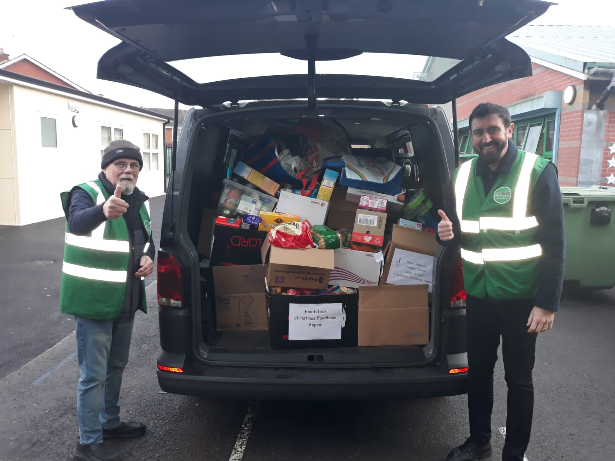 Paul Doherty from Foodstock, right, collects some of the gifts that have been bought