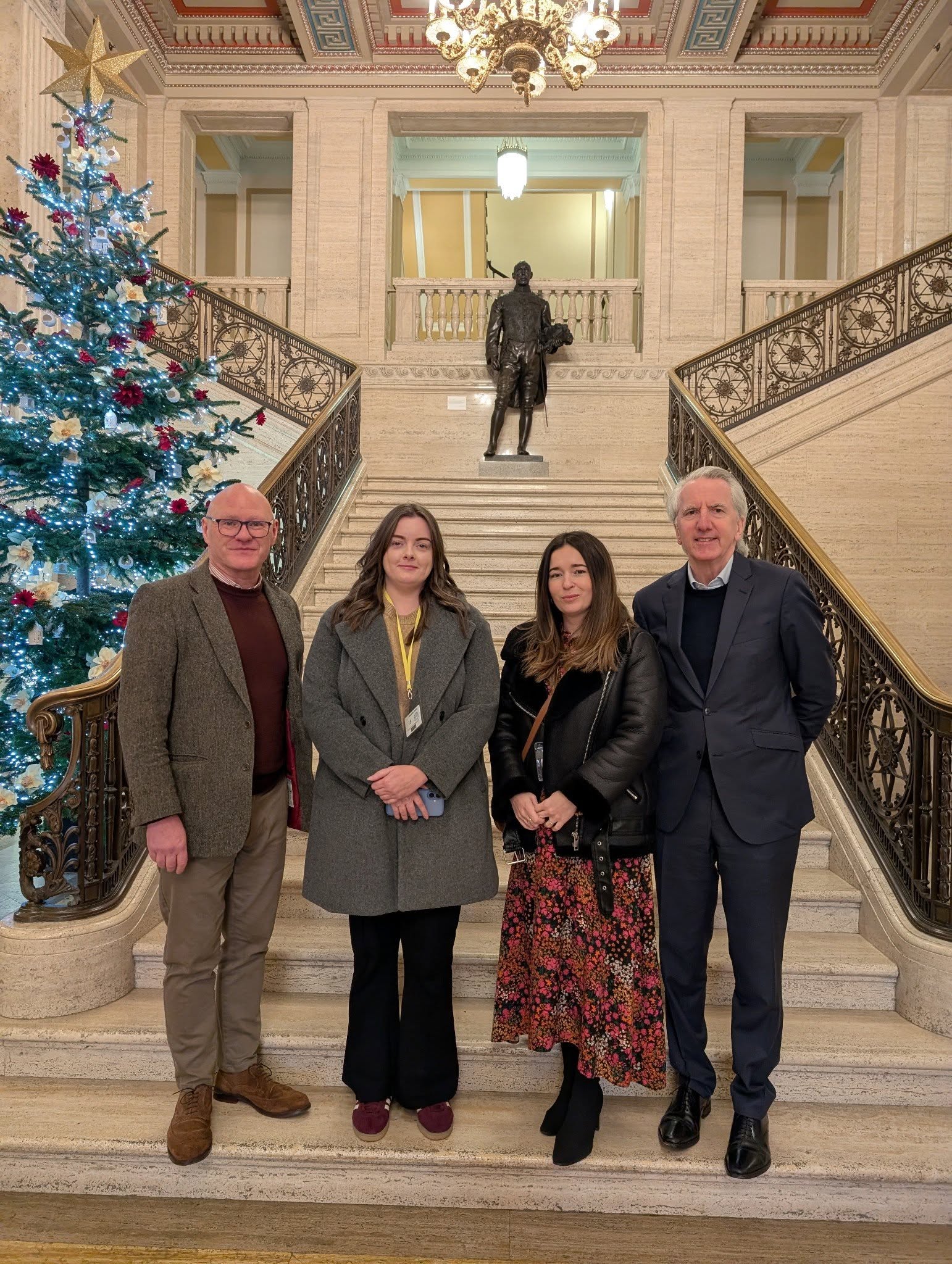 Paul Maskey MP, Eimear Hargey (Fáilte Feirste Thiar), community worker Aoife McCallum and Máirtín Ó Muilleoir 
