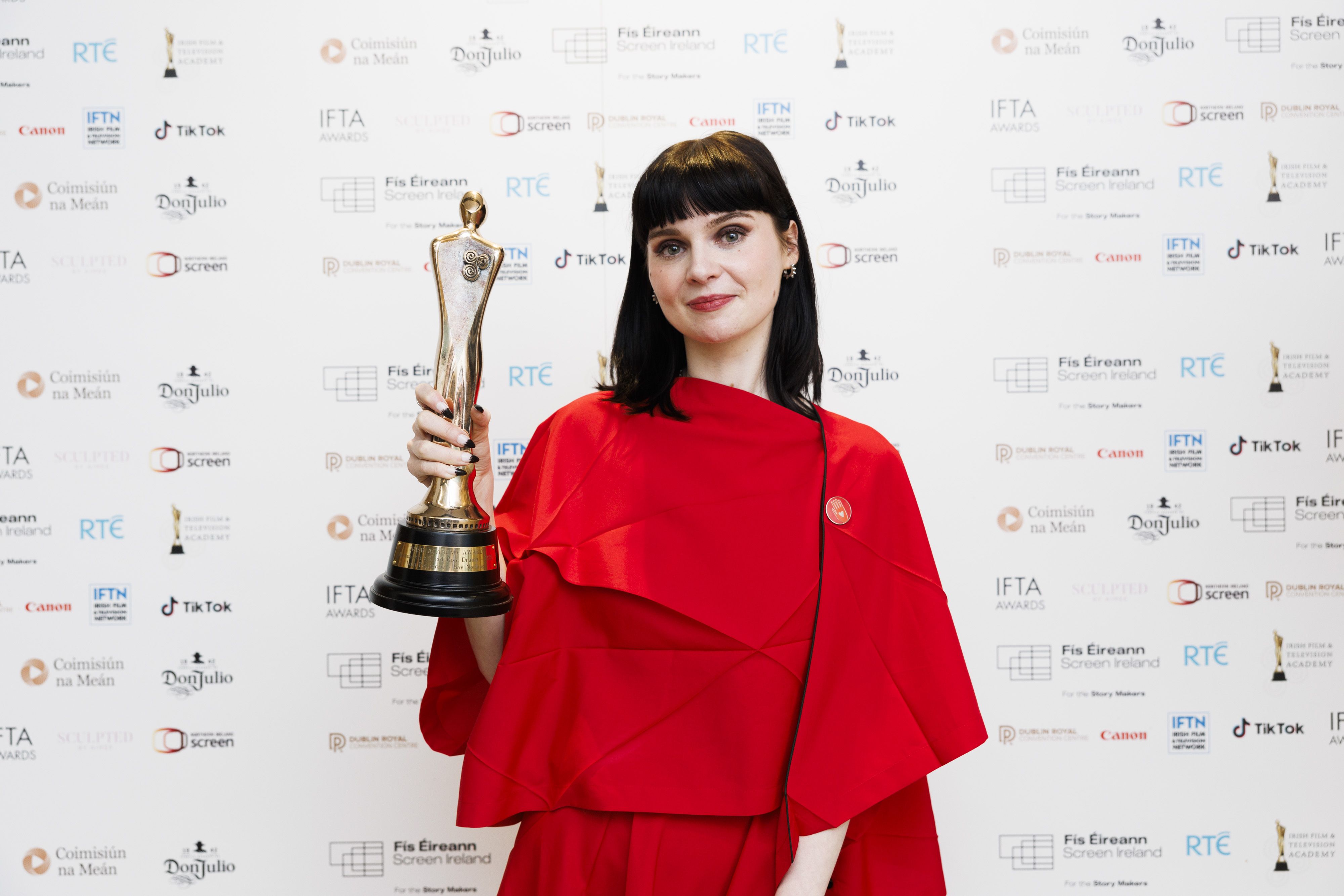 West Belfast actress Lola Petticrew celebrates her award at the IFTAs