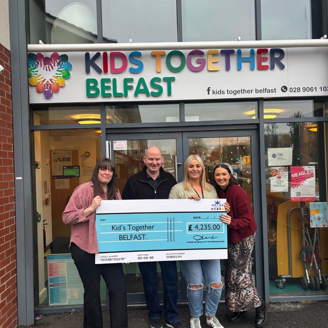 Bronagh McKernan from The Ortus Group with members of staff from Kids Together.  