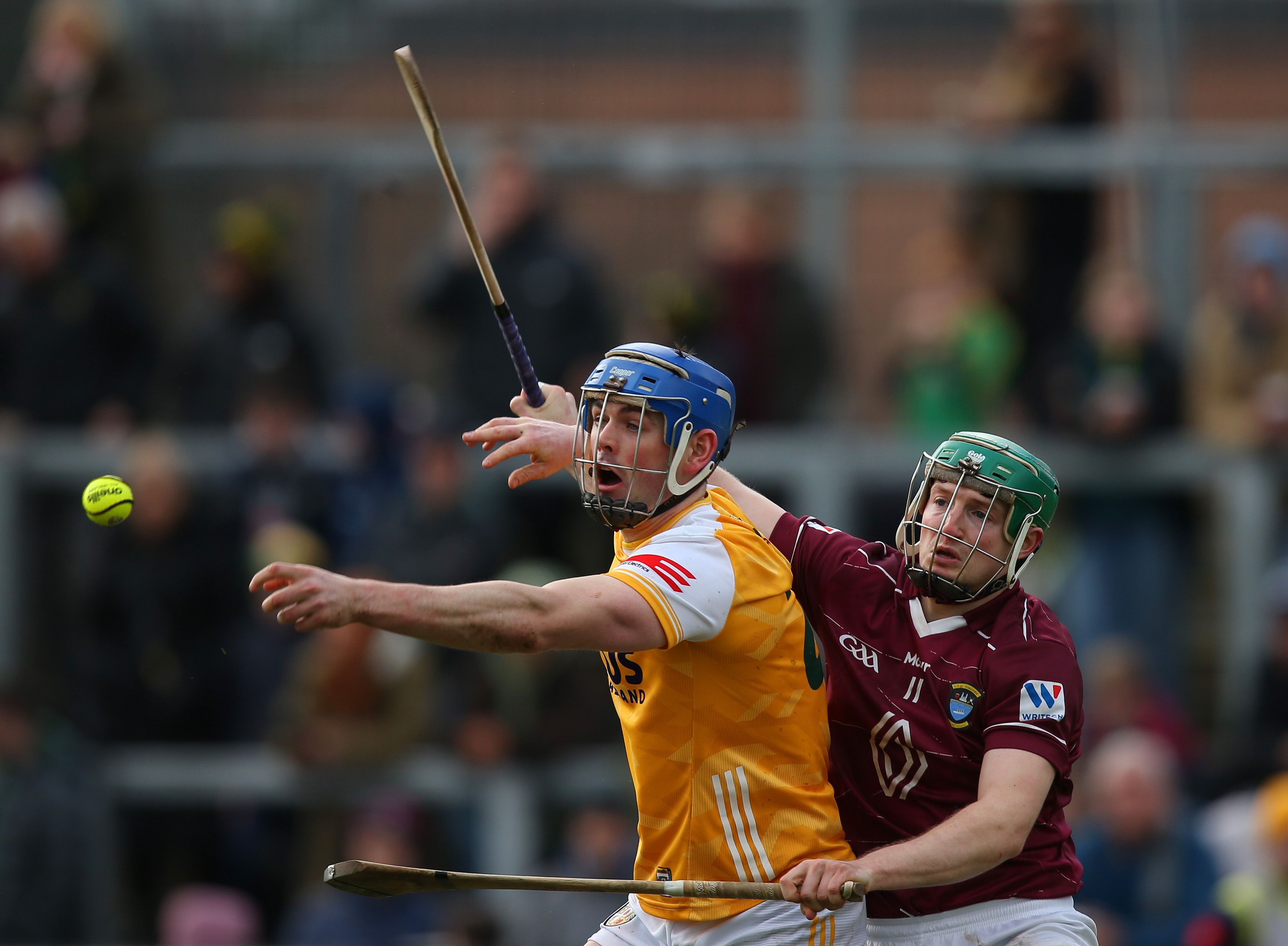 Gerard Walsh gets the ball away despite the challenge of David Williams