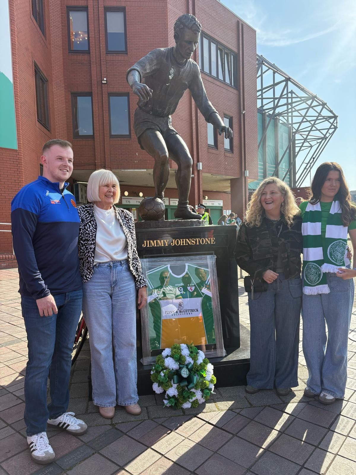 The family of Anto Finnegan meet the family of Jimmy Johnstone at his statue outside Celtic Park
