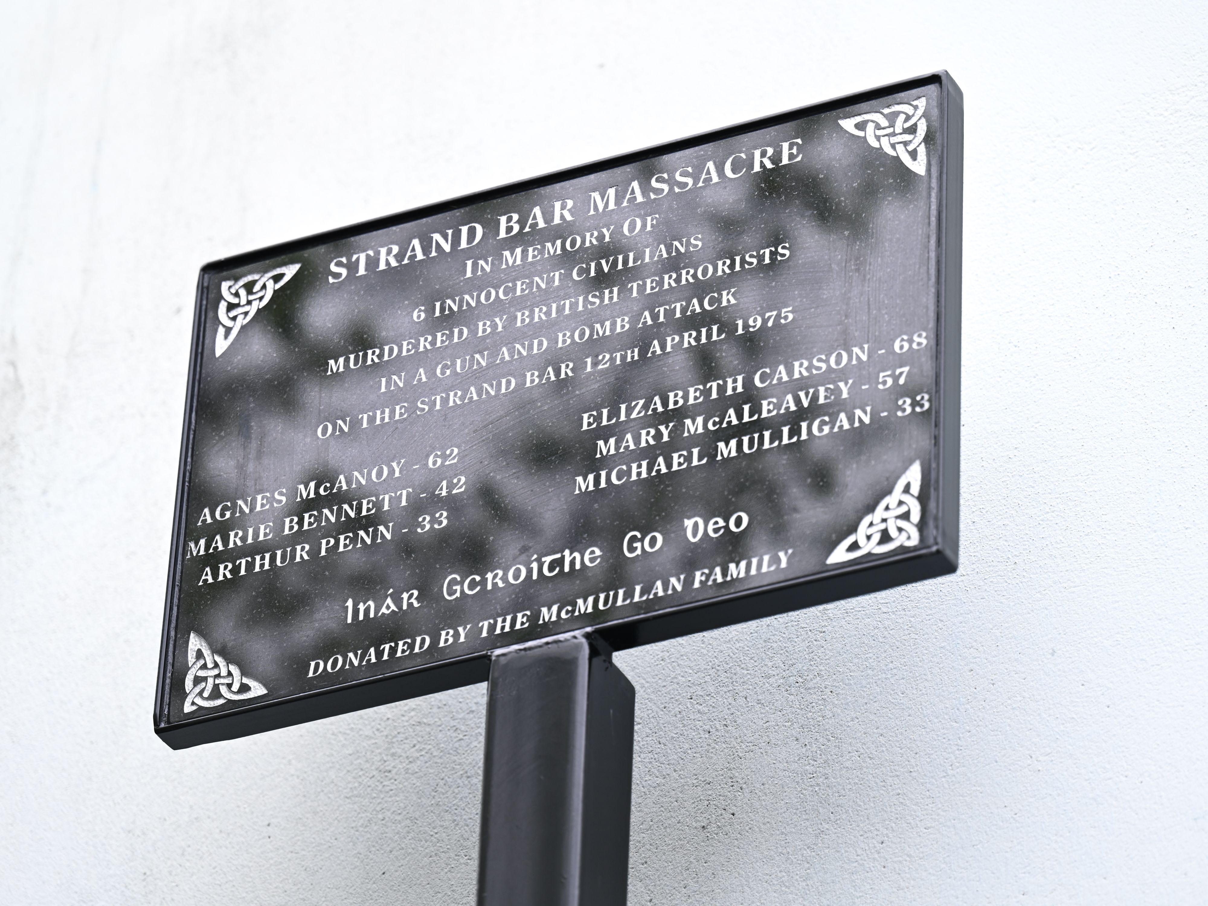 A plaque marks the spot of the massacre
