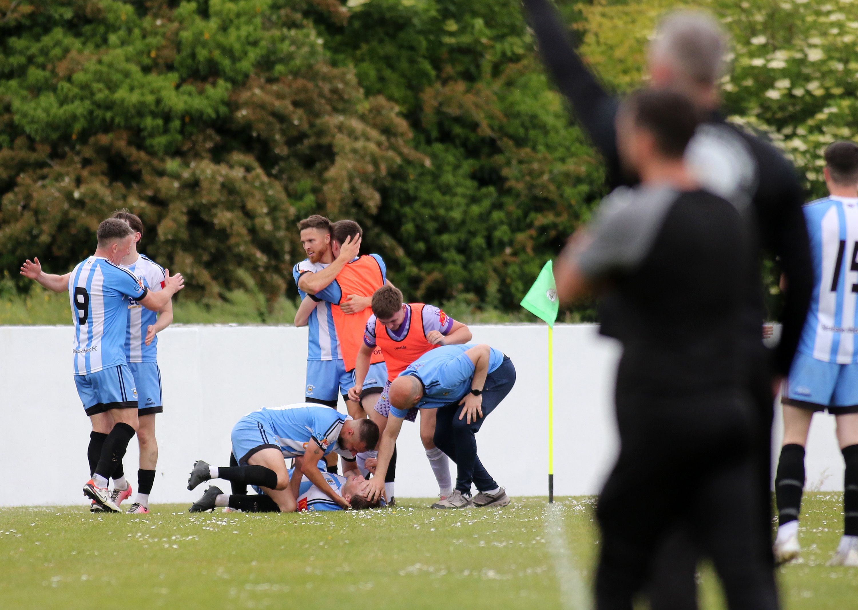 Niall McGlynn is mobbed after scoring what proved to be the winner
