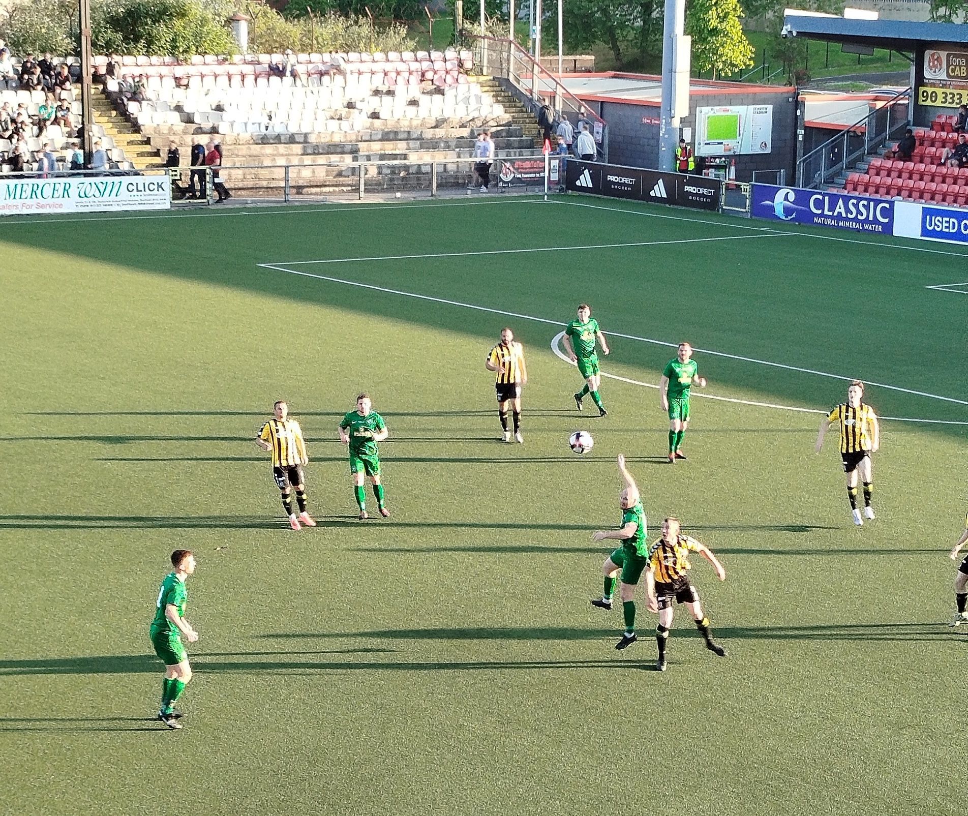 Joe McNeill gets up to win a header 