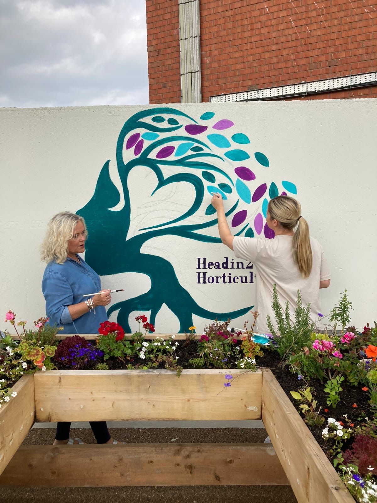 PAINTING A PICTURE: Head2Horticulture mural at their garden 