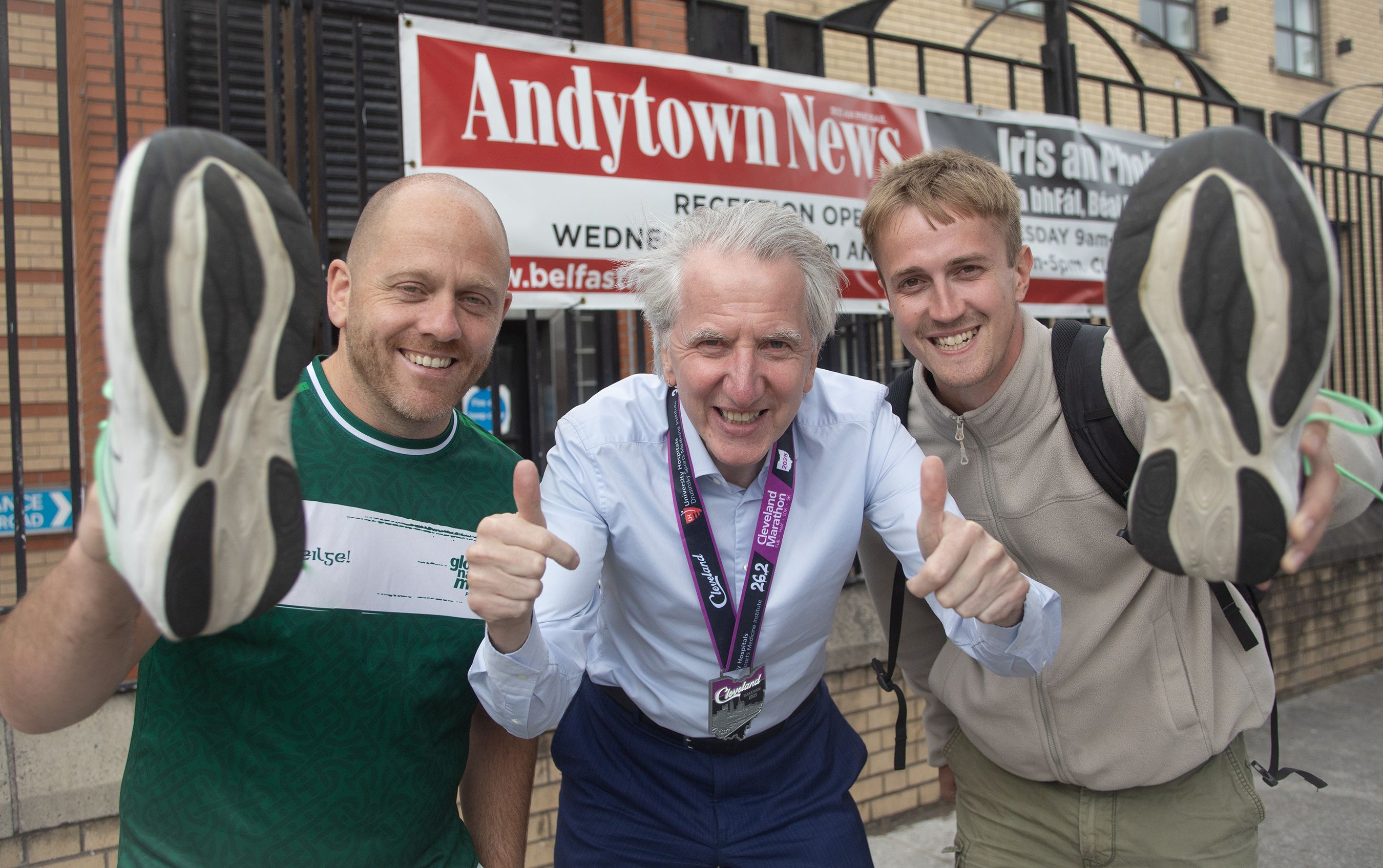 RITH MAITH: Belfast Media's Máirtín Ó Muilleoir who recently ran the Cleveland Marathon to support the new hall appeal with Feargal Mac Ionnrachtaigh and Eoghan Ó Garmaile of Glór na Móna