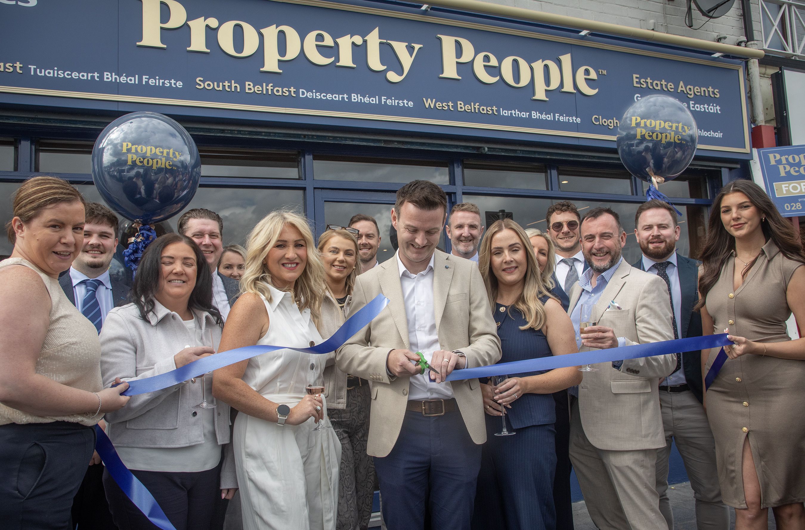 Cutting the ribbon at the Property People opening